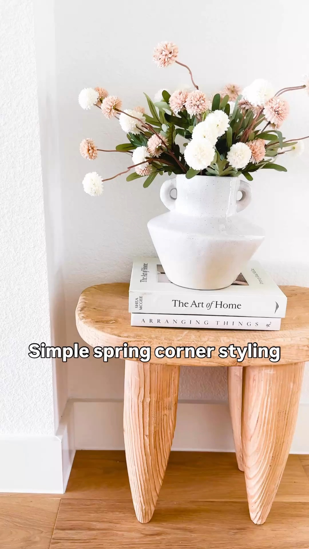Simple spring home styling using a neutral color palette, textured wood accents, and soft florals to create a high-end designer look. This cozy corner styling idea is perfect for entryways, living rooms, or small spaces and shows how to style a vase with faux flowers, coffee table books, and natural wood furniture for an elevated everyday home aesthetic. Follow me on LTK for daily home decor ideas, Amazon finds, and simple styling inspiration.


#LTKSeasonal #LTKHome #LTKSaleAlert