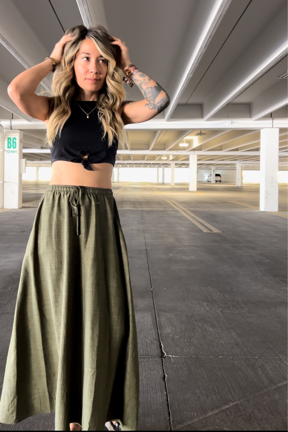 Cute long green skirt. Black sleeveless crop top. Platform sandals 

#LTKStyleTip #LTKFindsUnder50 #LTKFamily