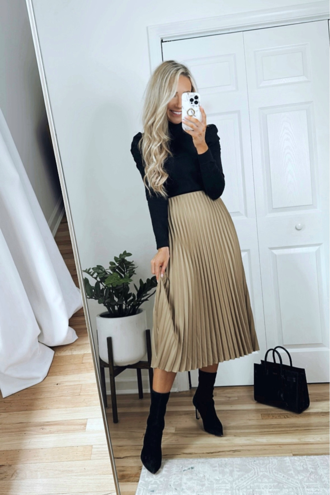 Work wear with boots! (*recommend sizing down one size in this skirt!) 

Camel pleated skirt, black sock booties outfit, chic outfit for work 

#LTKworkwear