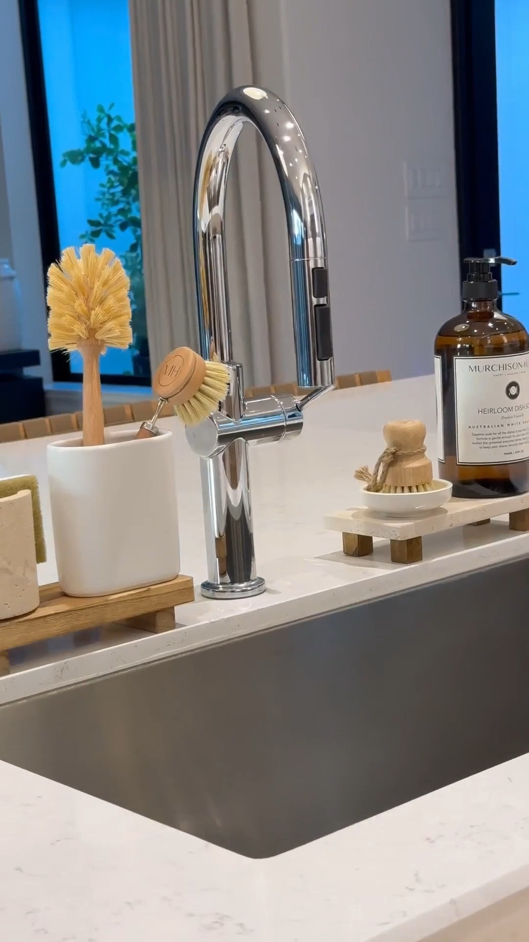 Kitchen Sink Essentials: 

Wooden & travertine risers 
Dish sponge holder 
Brush holders
Glass, pot, and dish brushes
Dish soap 
#LTKStyleTip 

#LTKSaleAlert #LTKHome