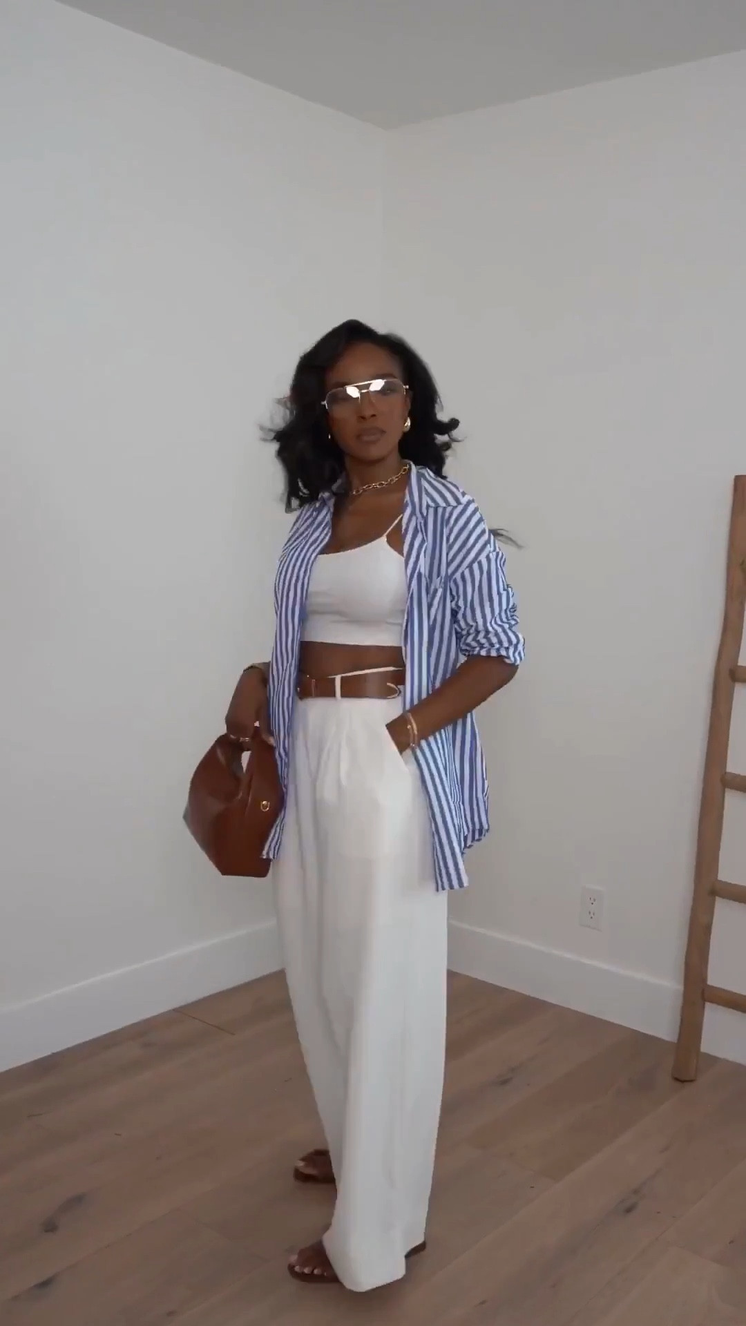 Scroll to shop this elevated casual summer look 🤍

A classic white base layered with a striped button-down instantly pulls the whole outfit together while still feeling effortless. These are the kind of timeless staples you can mix and restyle endlessly, making the cost per wear so worth it.

Perfect for errands, brunch, travel days, and casual outings.

📏 Measurements: 5’4”, 140 lbs, 34D bust, 27” waist, 40” hips

Follow me on Instagram and YouTube @kirasfashionfinds
