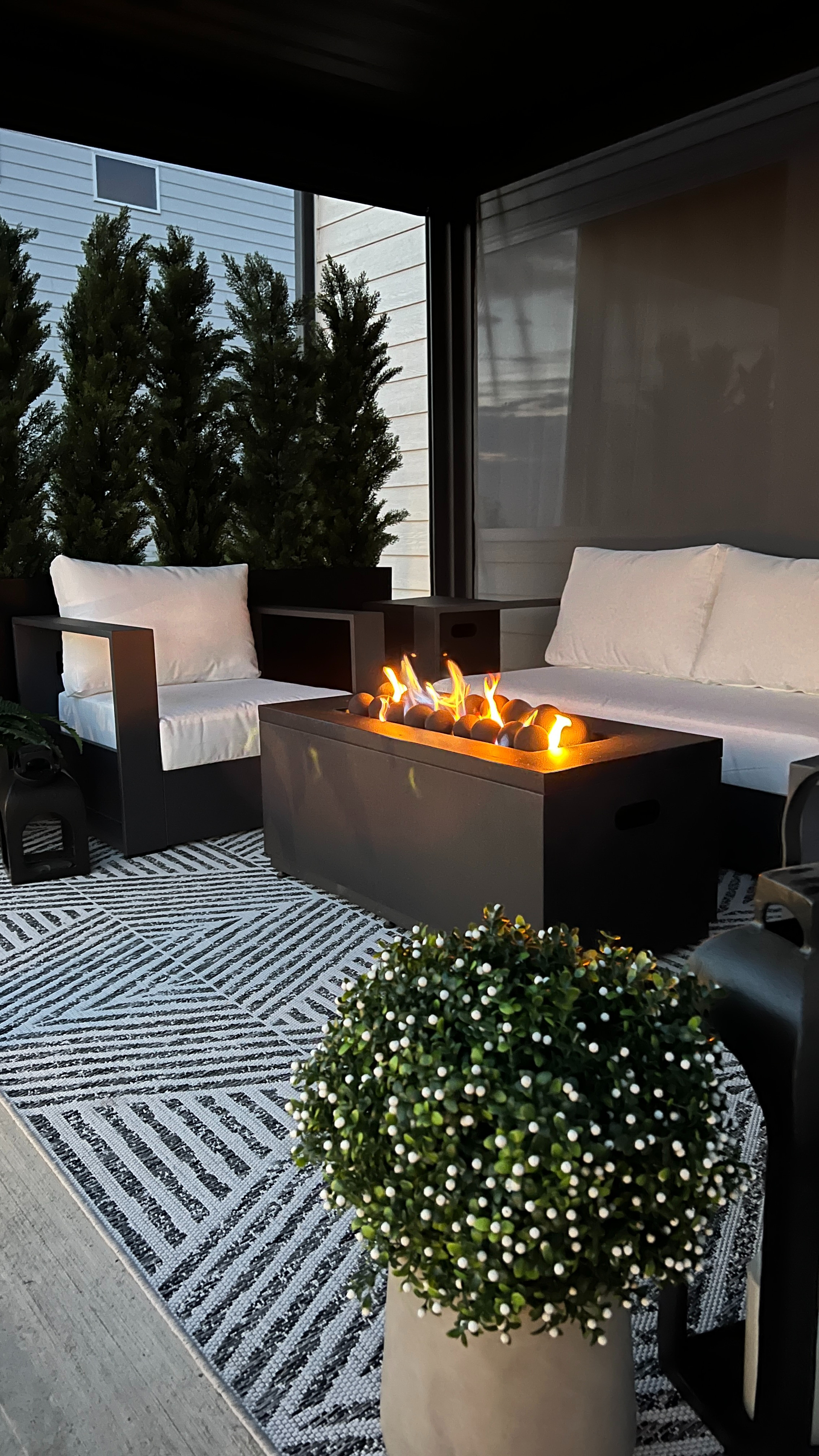 This is the piece that makes everyone want to stay outside longer 🤍 It’s cozy, functional, and perfect for hosting. Love how it looks with our patio seating and rug. The neutral planters and faux plants just bring the space to the next level of cozy. 

 

#LTKSeasonal #LTKHome