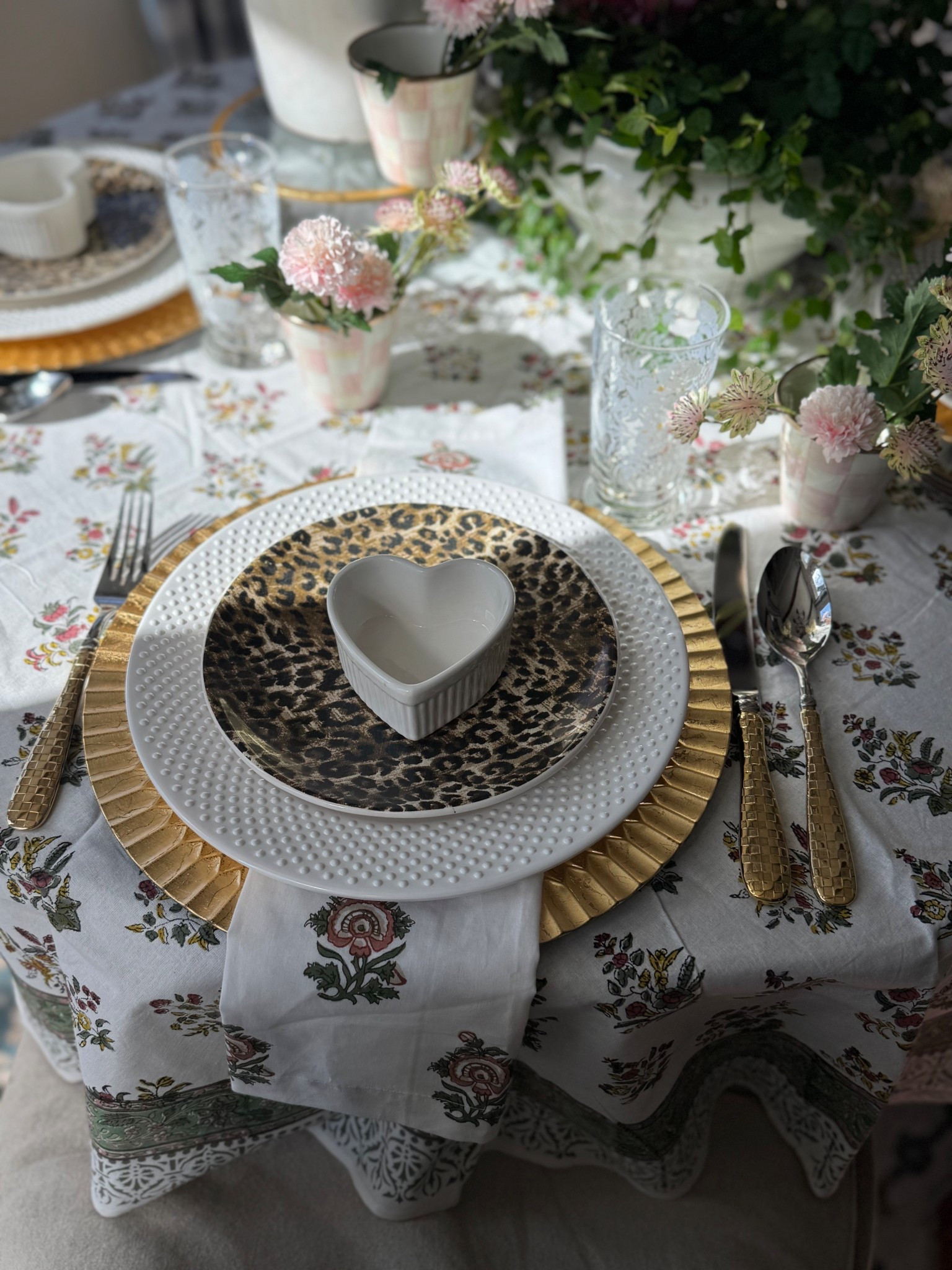 I created a subtle Valentines table with items I had on hand. Floral blockprint tablecloth, floral napkins, gold flatware, MacKenzie-Childs herb pots, gold charger, white melamine plates, heart ramekin, artificial pink flowers

#LTKHome #LTKSaleAlert #LTKValentine