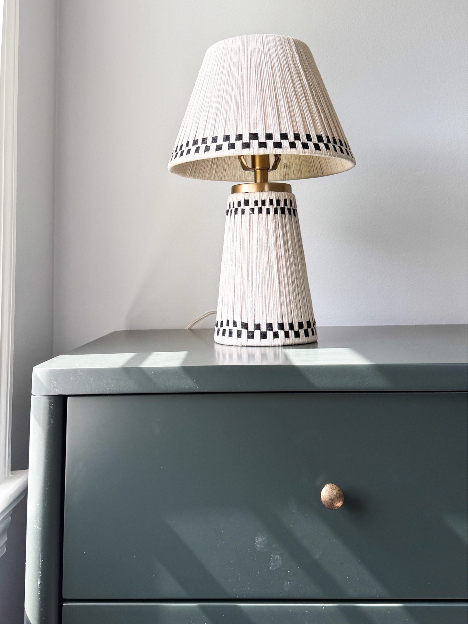 This lamp is such a good mix of texture and pattern. The woven detail, black trim and brass accents make it feel like a statement without overpowering the space.

table lamp, statement lamp, woven lamp, bedroom lighting, brass accents, home decor, bedside lamp, patterned lamp, accent lighting, interior styling, girlonthehudson

#LTKHome #LTKSeasonal #LTKdayinmylife