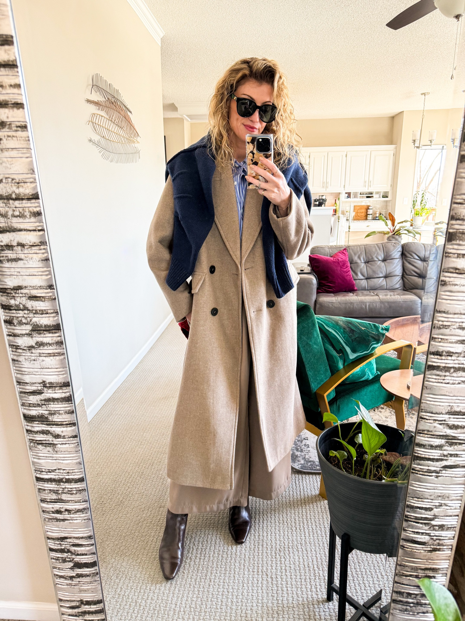 A long coat and a sweater over the top 