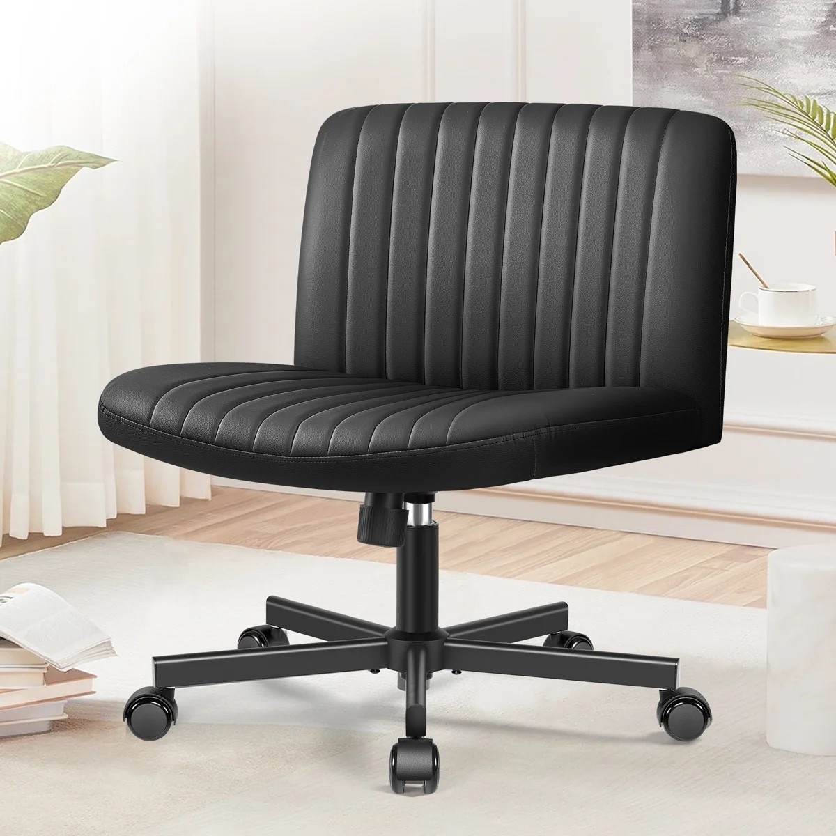 Only $89 such a grab for this black wide-seat office chair from Wayfair is such a good-looking desk upgrade. I love the channel-tufted upholstery, armless design, cushioned seat, and rolling five-wheel base for a home office, vanity, or study space. On sale at Wayfair. #WayfairFinds #OfficeChair #HomeOffice #DeskChair