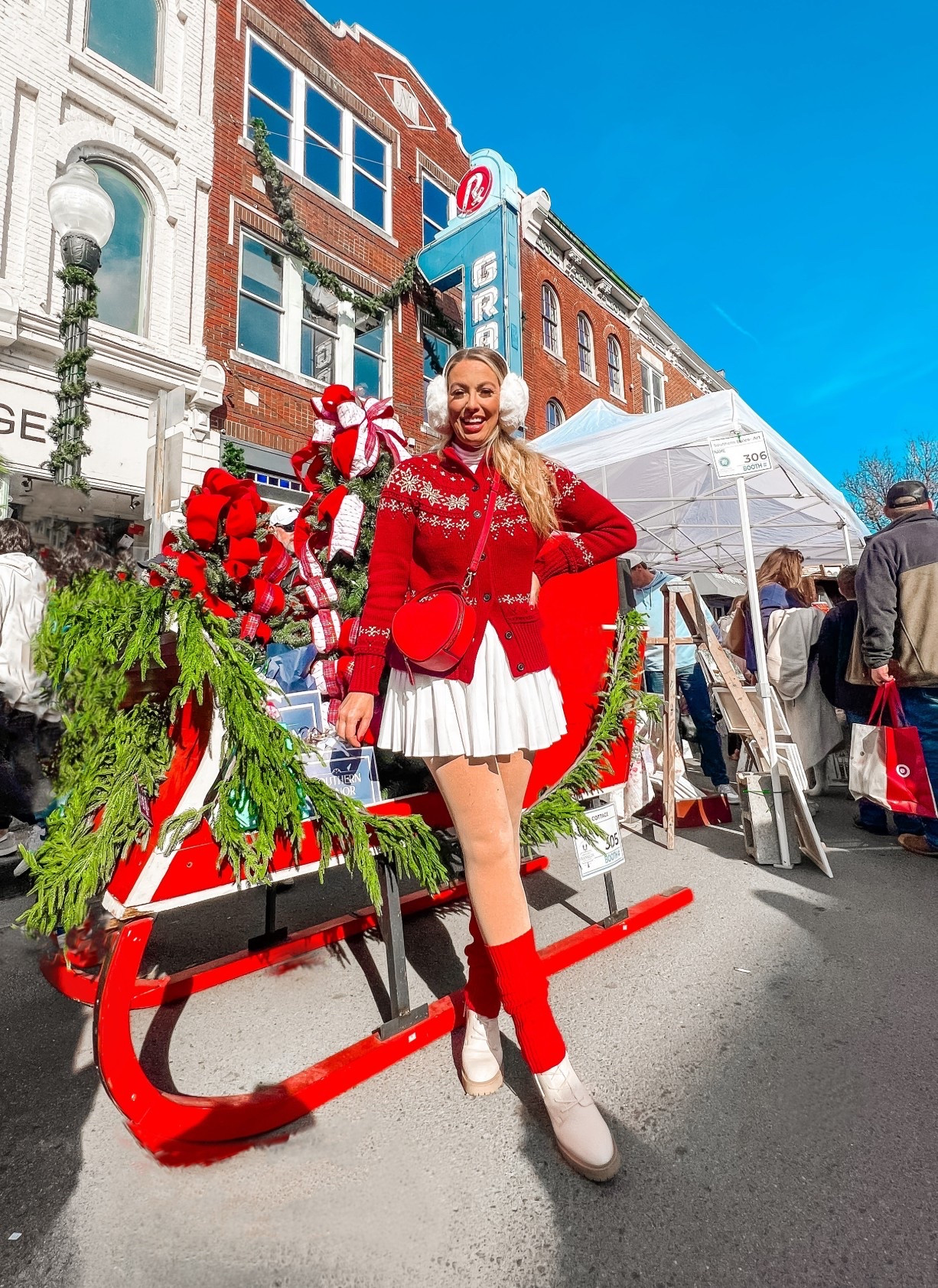 Christmas outfit inspiration 
Red snowflake sweater + white tennis skirt + cream boots + red heart purse

#LTKTall #LTKMidsize #LTKPlusSize