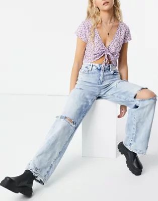 Bershka 90s wide leg jean with knee rip in blue | ASOS (Global)