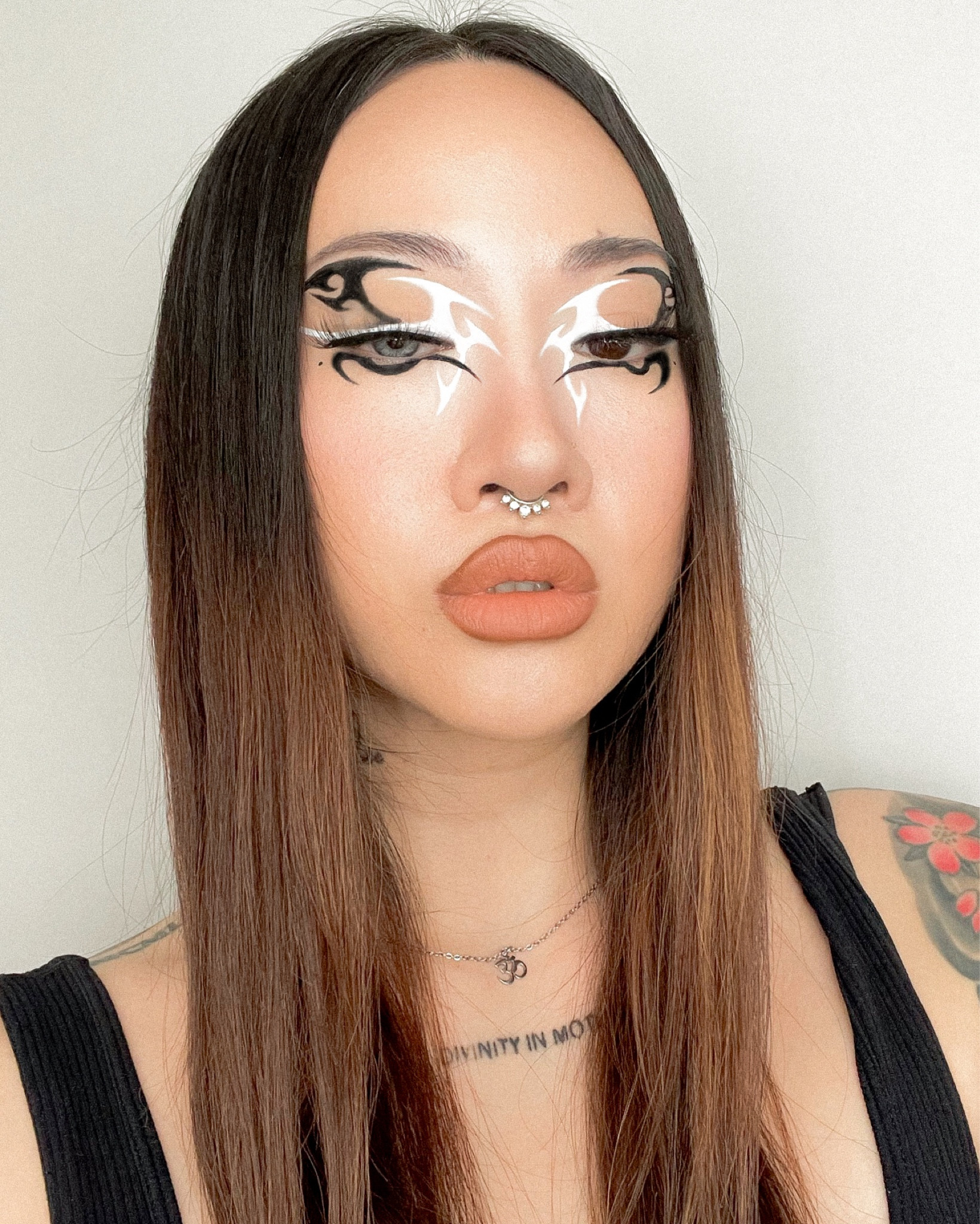 Black and white graphic eyeliner look ~ 
Discount codes below 👇🏻 
Black and white graphic eyeliner look using water activated liner “skate date” from gavissi (% off code: DIVINA), with MAC fluidline, and carbon black eyeshadow added on top for that extreme matte black finish.  

FACE 
CT magic cream as primer 
CT  hollywood flawless filter — 2 fair 
ABH luminous foundation — 140N 
ABH magic touch concealer 2 (under eyes)
illamasqua skin base concealer pen — L2 
(N/a to tag but discount code available) Flower knows embossed blush — classic ballet (5% off: DIVINA) 
Colour pop bronze stix — laguna 
MAC fix+ 
MAC studio fix powder — NC10 (under eyes)  
EYES
(N/a to tag but discount code available)Moody lens eye contacts — barbie grey (15% off code: DIVINA15) 
MAC eyeshadow — blanc type, omega 
(N/a to tag but discount code available) Gavissi retro liner — skate date with GV12 brush (10% off code: DIVINA) 
MAC fluidline — blacktrack, then added MAC eyeshadow “carbon” on top for that extreme black matte. 
L’OREAL brow stylist definer — dark brunette 
Kiss lashes x Marylin Monroe — it-girl 
LIPS  
ABH lip liners — “cool brown” for liner and “caramel” for filling entire lip 

— 
Graphic eyeliners, graphic makeup, creative eyeshadow, makeup look, beauty makeup, luminous foundation, natural foundation, pink blush, brow pencil, drugstore brow pencil, makeup inspo, fall makeup, dark makeup, halloween makeup inspo, creative makeup inspo, graphic eyeliner look inspo, makeup inspirations, creative eye makeup ideas, eyeliner look, creative eyeliner, beauty makeup, dark glam makeup, creative eyeliner inspiration, eyeliner types 

#LTKsalealert #LTKbeauty #LTKstyletip