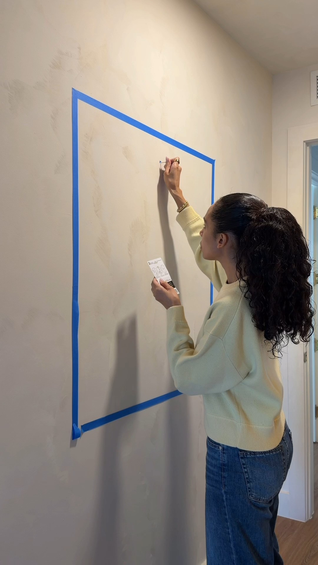 Easiest way to hang artwork by yourself 👏 use blue tape to map it out, mark the nail spot, and hang with a deco hook.. no extra tools needed!

#diyhome #hometips #wallart #homedecorideas 
