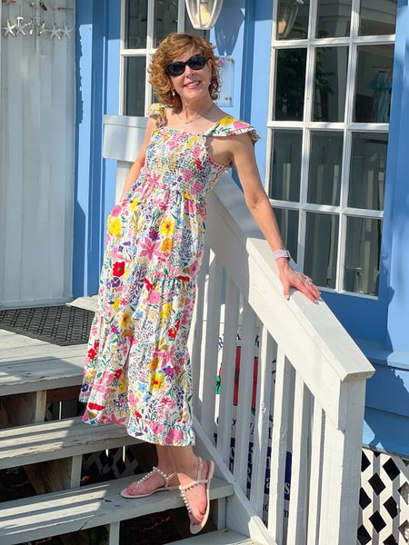 This summer dress has everything you need! It's a floral dress, with a smocked bodice, a tiered skirt, a wide ruffle hem, and ruffle sleeves. So feminine!
I paired it with a pearl Apple Watch band, pearl and gold earrings, and nude pearl embellished jelly sandals.


#LTKstyletip #LTKshoecrush #LTKSeasonal