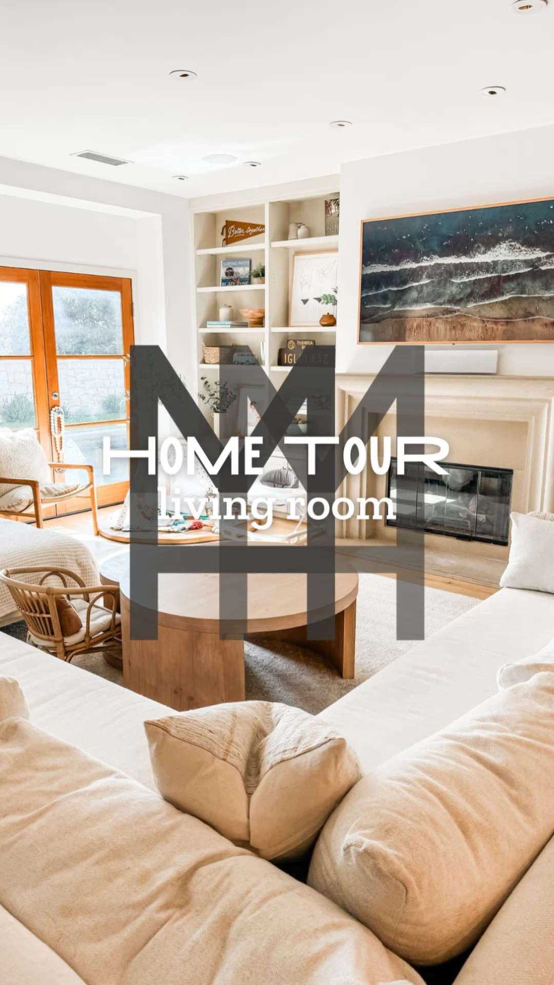 ✨MHMH Home Tour Series✨ Space #3 … the living room! 

The living room is the heart of the home 🖤 and especially when you’ve got kids in the house! We eat, play, cuddle, nap in here so it’s gotta be able to look good and be durable to hold up to all the time spent here. I designed our living room to look chic, but maintain a relaxed and family-friendly vibe. 

A large sectional in a high performance fabric means it cleans up easily and provides plenty of seating and snuggling space. Round coffee tables protect kids from sharp corners, and this set does quadruple duty - not just a coffee table, the small nesting table doubles as a kid size table, there’s space for toys underneath, and the large table makes an awesome fort. 

I pump up the designer vibes in the lesser used spaces, with chicly styled shelving, console, and a cozy corner seating moment. 

And that beautiful art over the fireplace? That’s our TV - The Frame TV from Samsung. This is a MUST HAVE. There is nothing stylish about a giant black box. Not only can you display any artwork on this, but you can get frames to match your decor - we have a light wood frame, duh 💁🏼‍♀️

#LTKHome