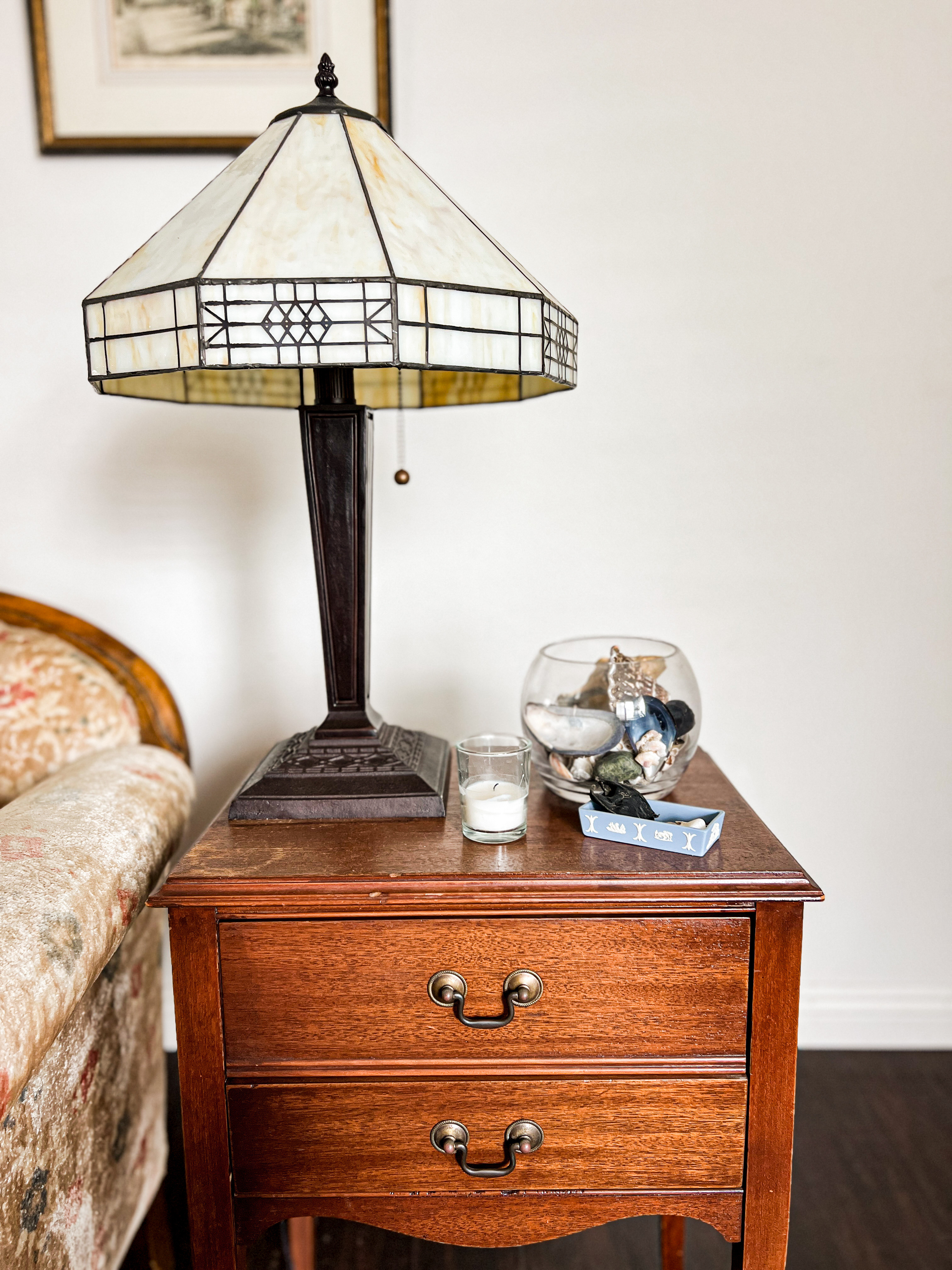 A pretty side table is always enhanced by the right lighting. This antique sewing table has a reproduction Craftsman-style lamp and some Wedgwood jasperware for a little bit of intrigue. 

 #LTKHome #LTKFindsUnder50 #LTKFindsUnder100
