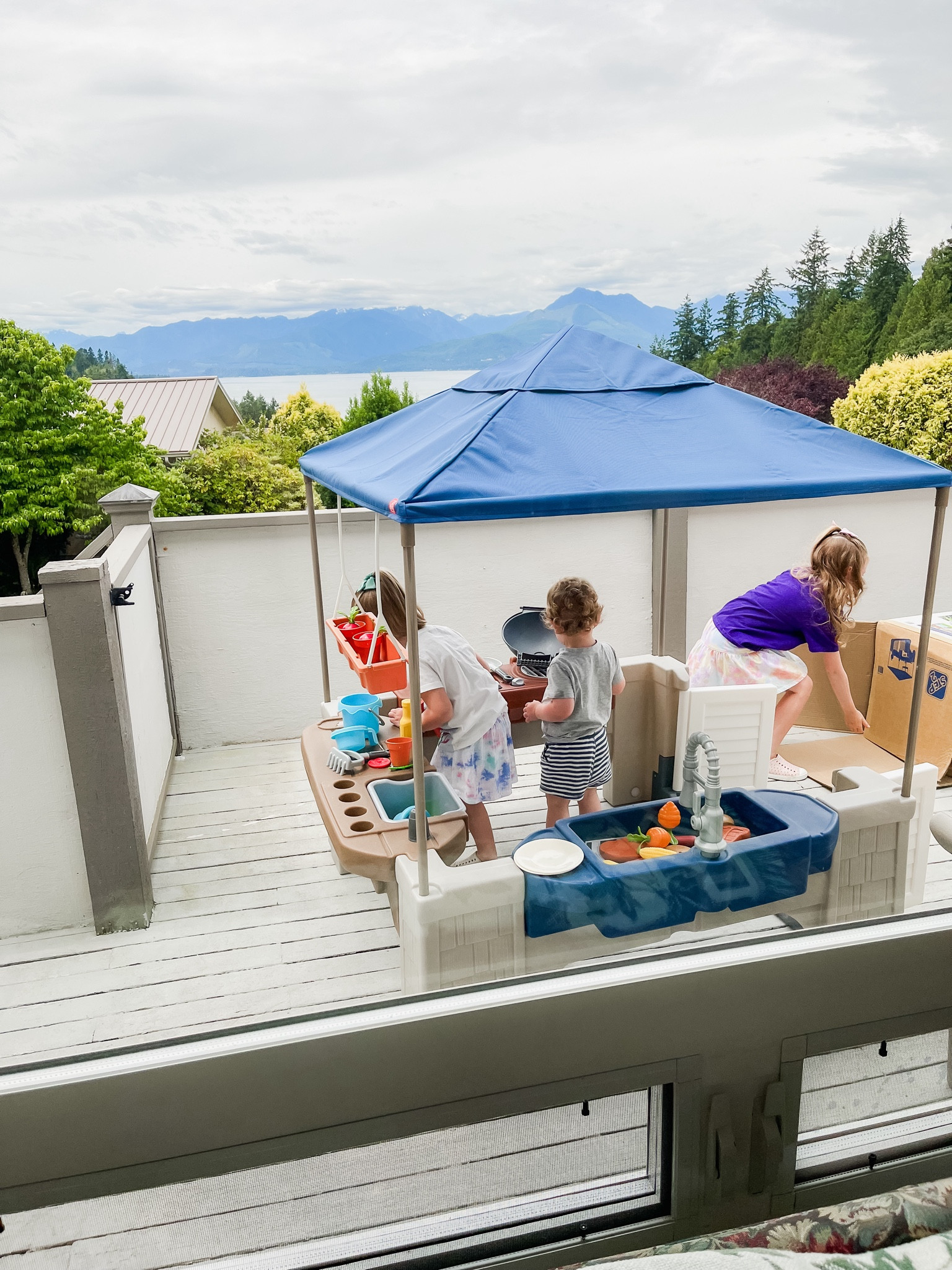 My kids are obsessed with this outdoor play patio kitchen! 
This is the Costco version but I found a near identical one (that I actually like better!). Has play grill, water area, cones with 16 accessories like play food, and has this canopy that is perfect for summer. My kids are 1.5-6.5 and I have been surprised with how engaged they all are with it! 

#LTKSummerSales #LTKKids #LTKFamily