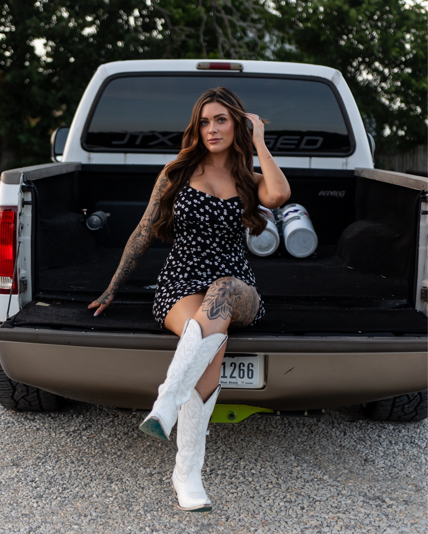 I’m a sucker for a black printed sun dress and my favorite Lane boots 🥰  wearing a size 6 in the dress and I’m normally between a size 4-6 #countryconcert #boots 