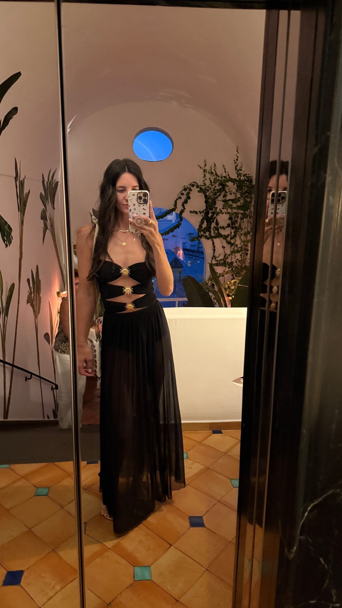 I’d say fits on the smaller side. I am wearing the small. Euro summer, Italy outfit, black vacation dress