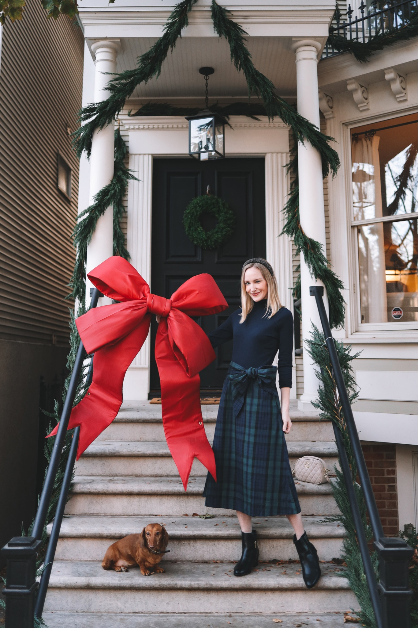 🌲🎀 This is a Lucy Larkin/JoJo Siwa-approved post! This year, Mitch surprised me and put up all the outdoor garland on his own. It was the best Christmas gift anyone could have given me. 😆 (Idk why, but garland is a daunting task; it just takes so long, and I always put it off!) He did, however, save the best part (the bow) for me. ;) But let's pause for a moment to appreciate this $36 (🤯) tartan dress from @walmartsfashion that you must own this holiday season. First of all, the bow. (Which is clearly the theme of this post.) Can you get over it?! I thought it was going to be hard to tie, but I tied it like I would ribbon on a present and it came out looking like this. So pretty! Second, the top is attached to the skirt, so there is absolutely no weird bunching or poofing. Third, it has pockets. Enough said, right? Wearing a small! Linking everything—including the big red outdoor bow in the 45″ x 36″ size—today on kellyinthecity.com and: #walmartpartner #walmartfashion 

#LTKsalealert #LTKunder50 #LTKHoliday