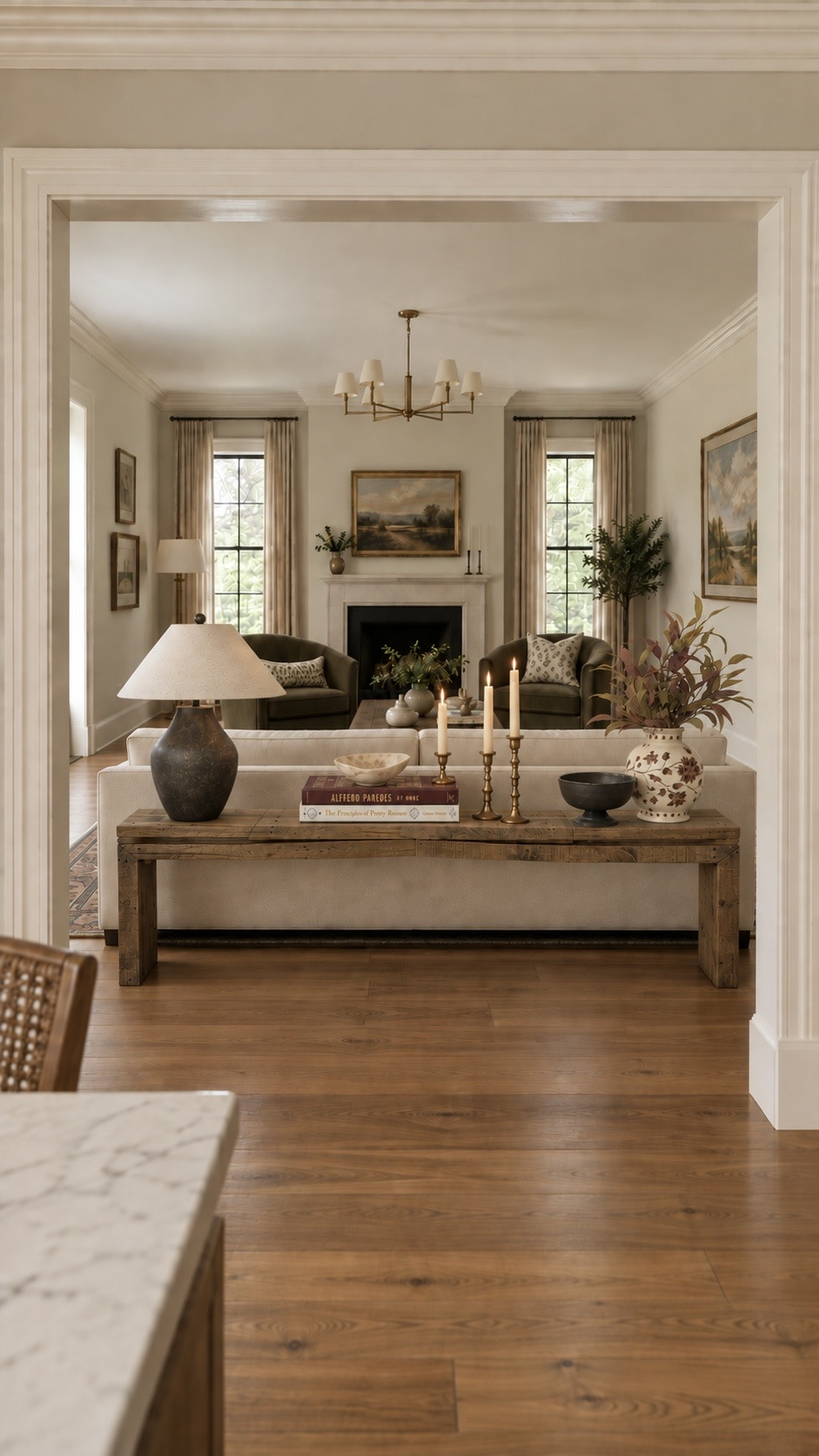 A living room furniture layout can completely change how a space looks and how it functions.

For this one, moving the sofa away from the wall helped create a more intimate conversation area, improved the flow through the room, and made room for a console table behind the sofa.

I love using a sofa table as an opportunity to add another layer to an open living room—especially when the back of the sofa is visible from an adjoining space. A great lamp, stacked books, vintage-inspired brass, pottery and collected accessories can make that view feel intentional instead of forgotten.

I linked the living room decor, console table styling pieces, lamp, accessories and similar finds from this design below!

And if it’s not the things in your room that you’re struggling with, but figuring out the layout or how to pull everything together, visit my website or send me a message for more details about my virtual design services.

#LTKHome