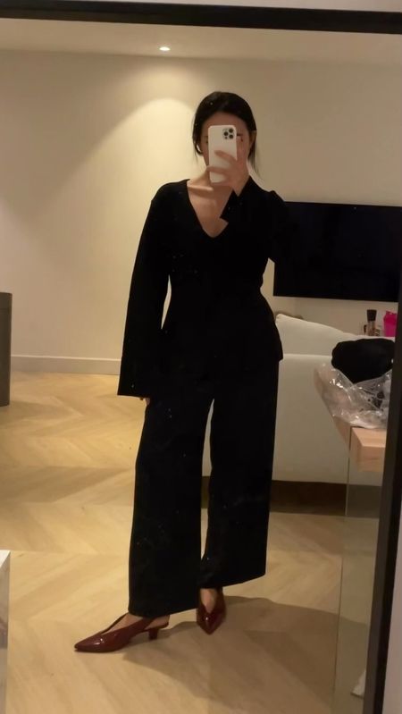 i love this black knit from H&M so much - it's such a good Khaite inspired top. It's true to size but to get a less fitted, more loose, look, I went with size
S.
I also have the same top in cream but much prefer this one!
one!
Pants are old uniqlo (but any flowy wide leg would do!)
Burgundy mules are Victoria Beckham (old collection) but reformation has a really good pair in a similar shade or public desire on asos.

#LTKstyletip #LTKSeasonal #LTKeurope