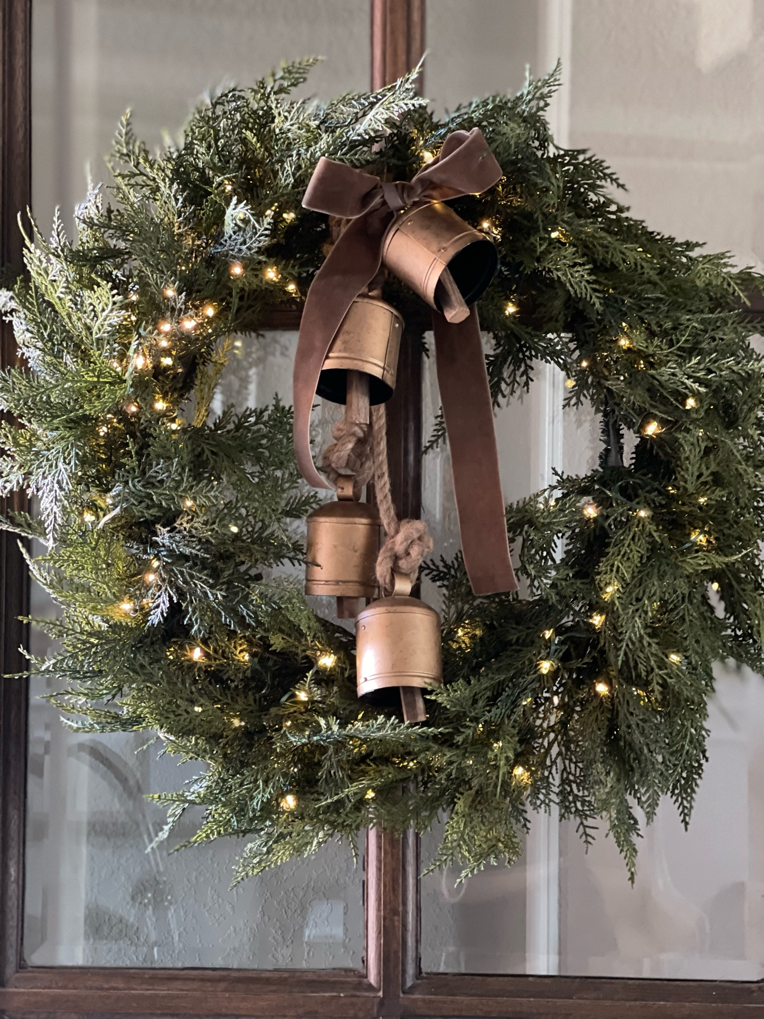 Christmas pre-lit wreath with rustic bells

#LTKHoliday #LTKhome
