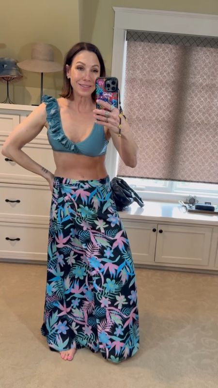 I am loving how this bikini matches the skirt perfect! Also the ruffle detail is just darling! The top is supportive but not too tight. The skirt is so light and flowy! Perfect Hawaii outfit! Wearing a small in the bathing suit and a small in the skirt. Skirt is by tipsy elves. 

#LTKover40 #LTKtravel #LTKSeasonal