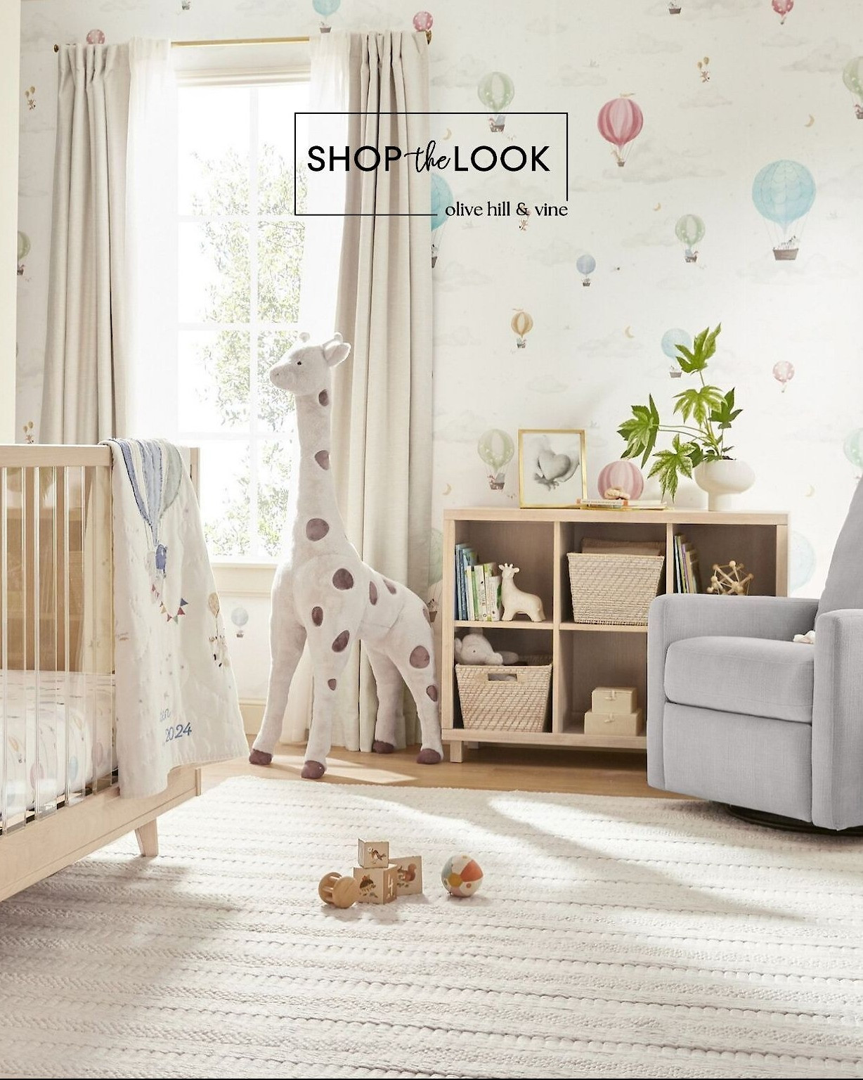 A dreamy nursery that takes style to new heights! This hot air balloon-themed space features a jumbo plush giraffe, a convertible crib with clear acrylic panels, a cubby shelf with woven baskets, and handwoven textures. Soft, airy patterns float across the bedding and wallpaper. 

 

#LTKHome #LTKBaby #LTKBump