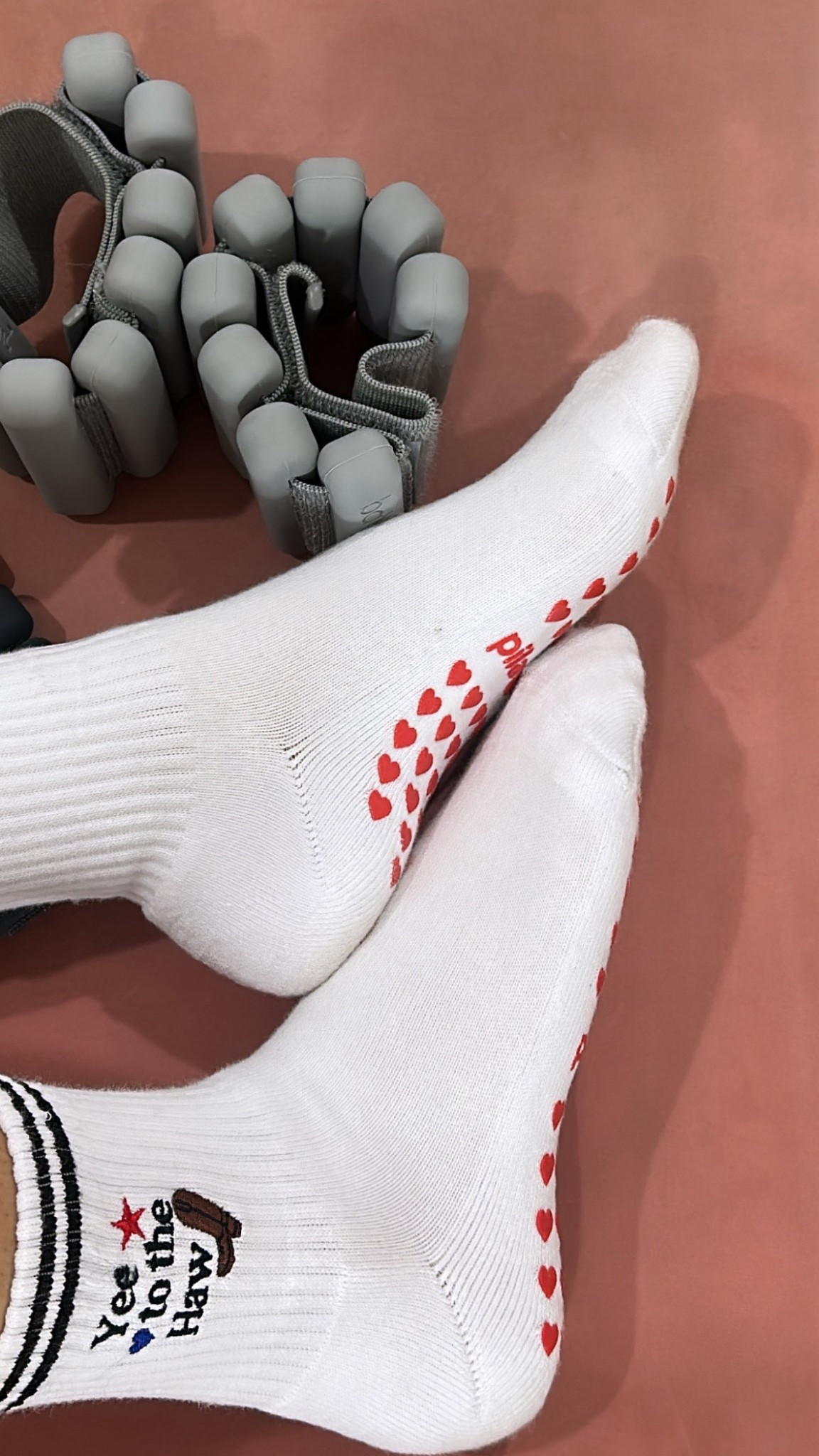 Yee to the Haw! Saddle up your studio style with these playful cowboy-themed grip socks, designed for Pilates, Barre, Lagree, or yoga lovers. These socks bring the perfect mix of functionality and personality to your workout wardrobe:

One-size fits most – US Women’s 5-11.
Embroidered details – Features “Yee to the Haw” with a cute cowboy boot, a star, and a heart.
Premier cotton – Luxuriously soft, breathable, and durable for all-day wear.
Black stitched stripes – Classic ribbed design with a touch of Western charm.
Non-slip red heart grips – Offers unbeatable stability and the Pila-Barre logo for authenticity.
Ribbed detail on top – For a polished, durable look and secure fit. 

#LTKActive #LTKfitnessgoals #LTKootd