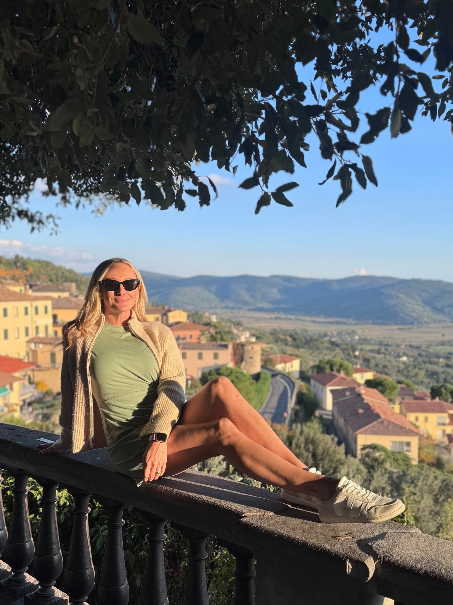 Casual chic Tuscany sightseeing outfit. 💚 This knot-front dress is comfy yet polished- perfect for walking tours, travel days, or weekend errands. The dress is on sale now too! Paired with chunky sweater, sneakers and Miu Miu sunnies- you’re set from summer to fall  

sage green dress, travel outfit idea, casual day dress, summer to fall outfit, walking outfit inspo, sneaker outfit, minimalist travel fashion, comfy chic outfit, neutral travel style, Italy travel, Europe travel outfit, Italy travel outfit, Fall outfit 
Miu Miu sunglasses

#LTKTravel #LTKOver40 #LTKSaleAlert