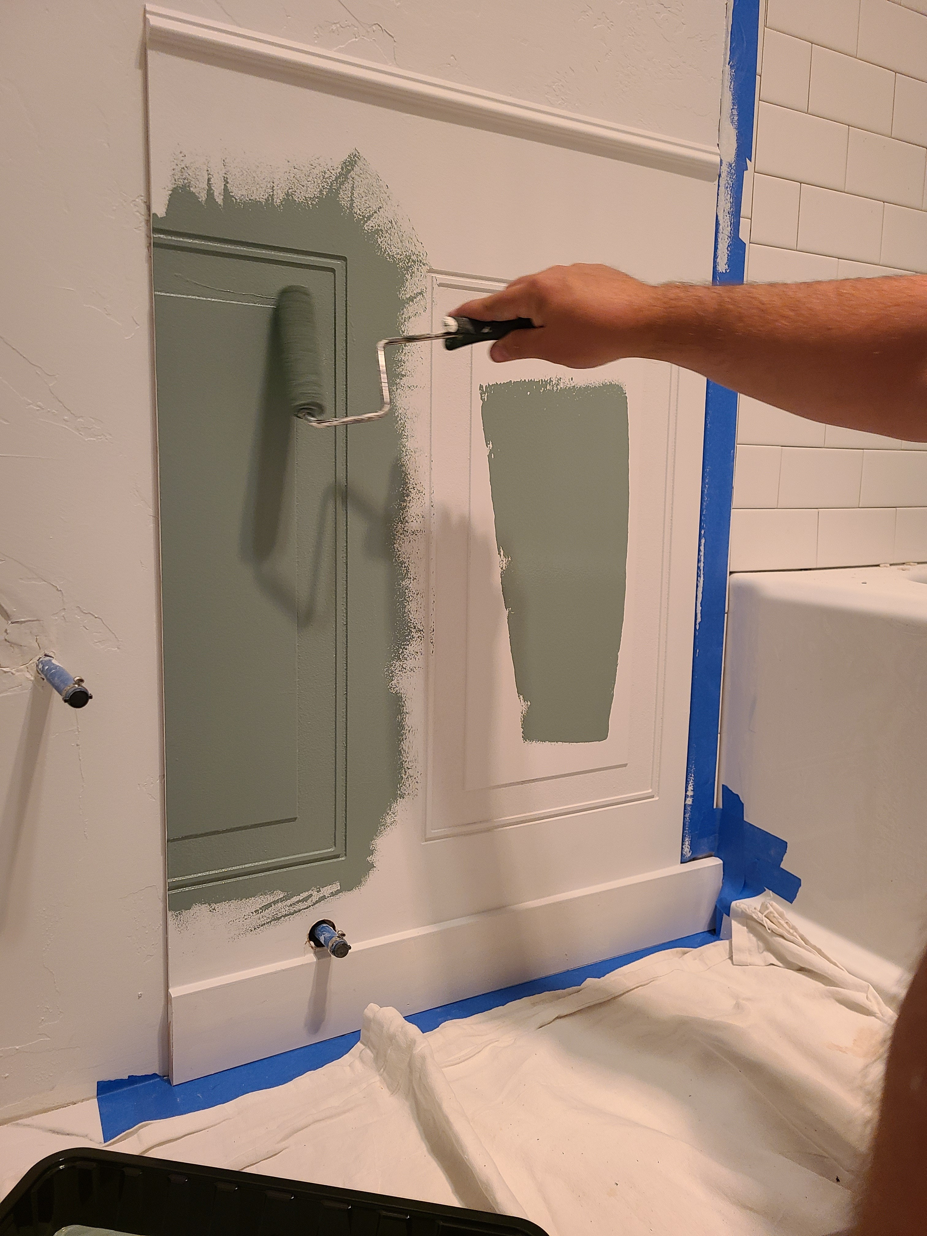 
Wainscoting panels in a bathroom instantly make it feel more finished and intentional. Paired with Behr In the Moment and the whole space goes from basic to really beautiful. That soft blue green is doing a lot of heavy lifting in here.  

 #LTKHome