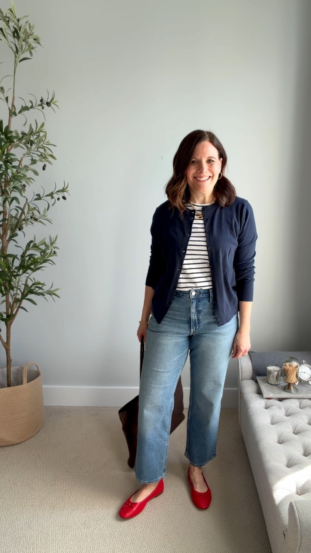 Stripes are one of my favorite ways to add visual interest to an outfit! Here I’m wearing a white-and-navy striped tee with a navy cardigan, straight-leg jeans, and red ballet flats for an unexpected pop of color. A brown woven tote bag grounds the look. Fit notes: curvy midrise jeans from J.Crew Factory fit TTS. I sized up to a medium in this tee. I’m in a large for this cardigan but a medium may work too. 

#LTKMidsize #LTKOver40 #LTKSaleAlert