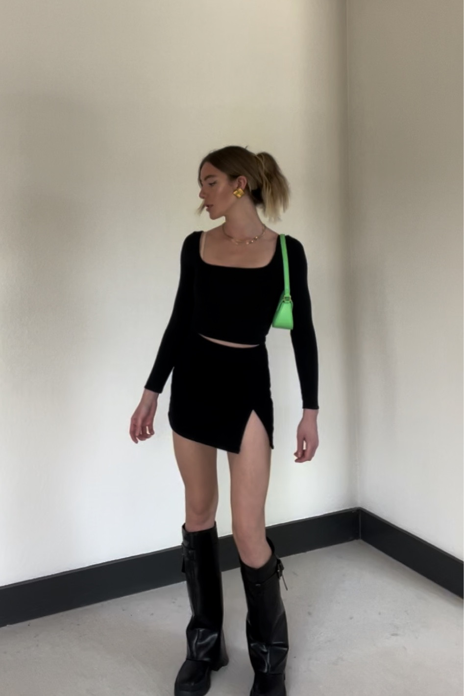 mini skirt, black top, foldover boots, statement purse, spring outfit, spring fashion, all black outfit 

#LTKitbag #LTKfindsunder100 #LTKstyletip