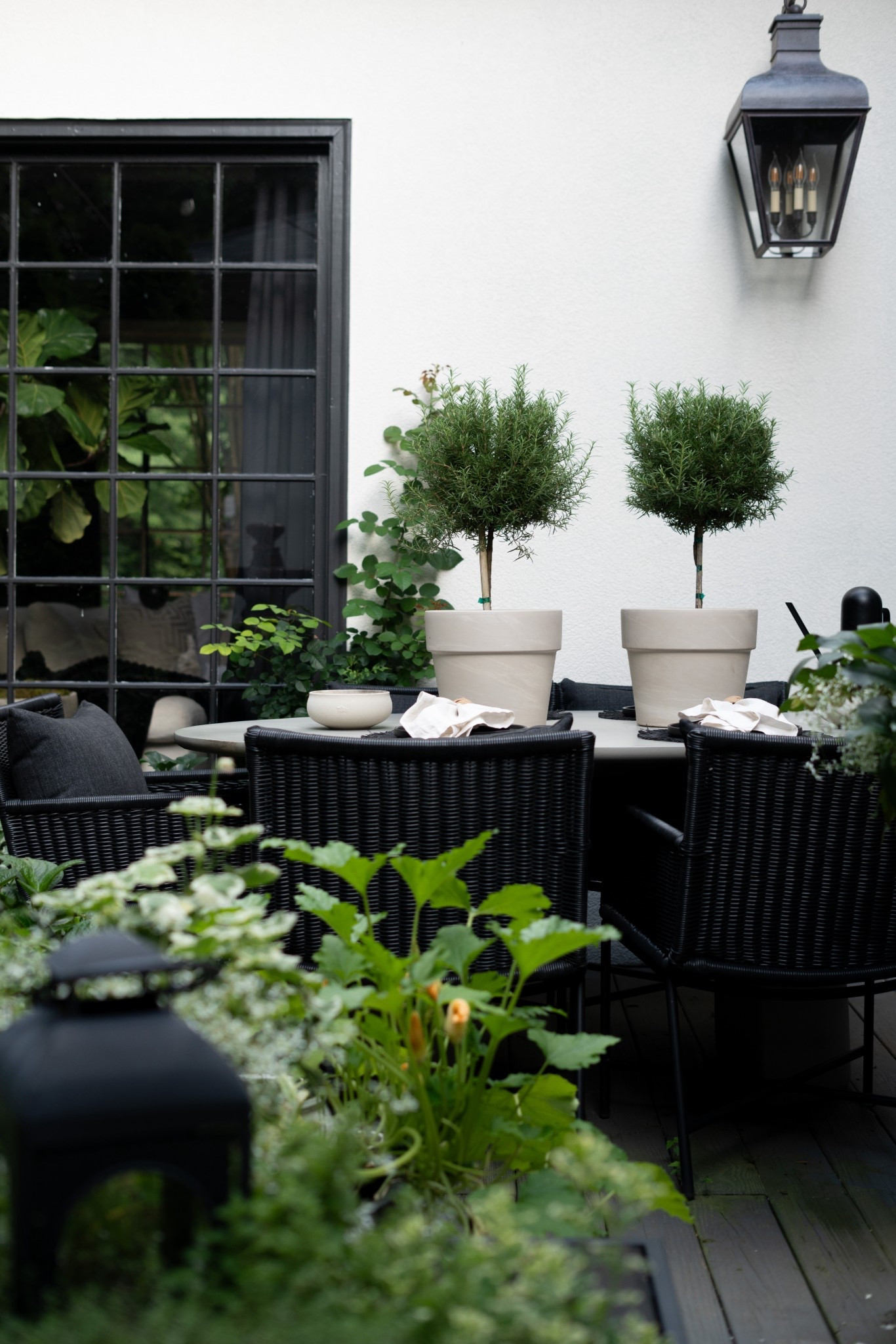 There’s just something magical about an outdoor space that feels like an extension of your home—and this patio is giving all the right vibes! I styled it with classic black and white pieces, layered in cozy textures, and brought it to life with lush greenery and topiary trees. That fountain? It adds the dreamiest sound and makes the whole space feel like a European courtyard. I even tucked in a few veggies and herbs—because why not mix gorgeous and functional? Whether you're hosting friends or sipping coffee solo, this setup is equal parts chic and comfortable.


#LTKStyleTip #LTKHome #LTKSummerEdit