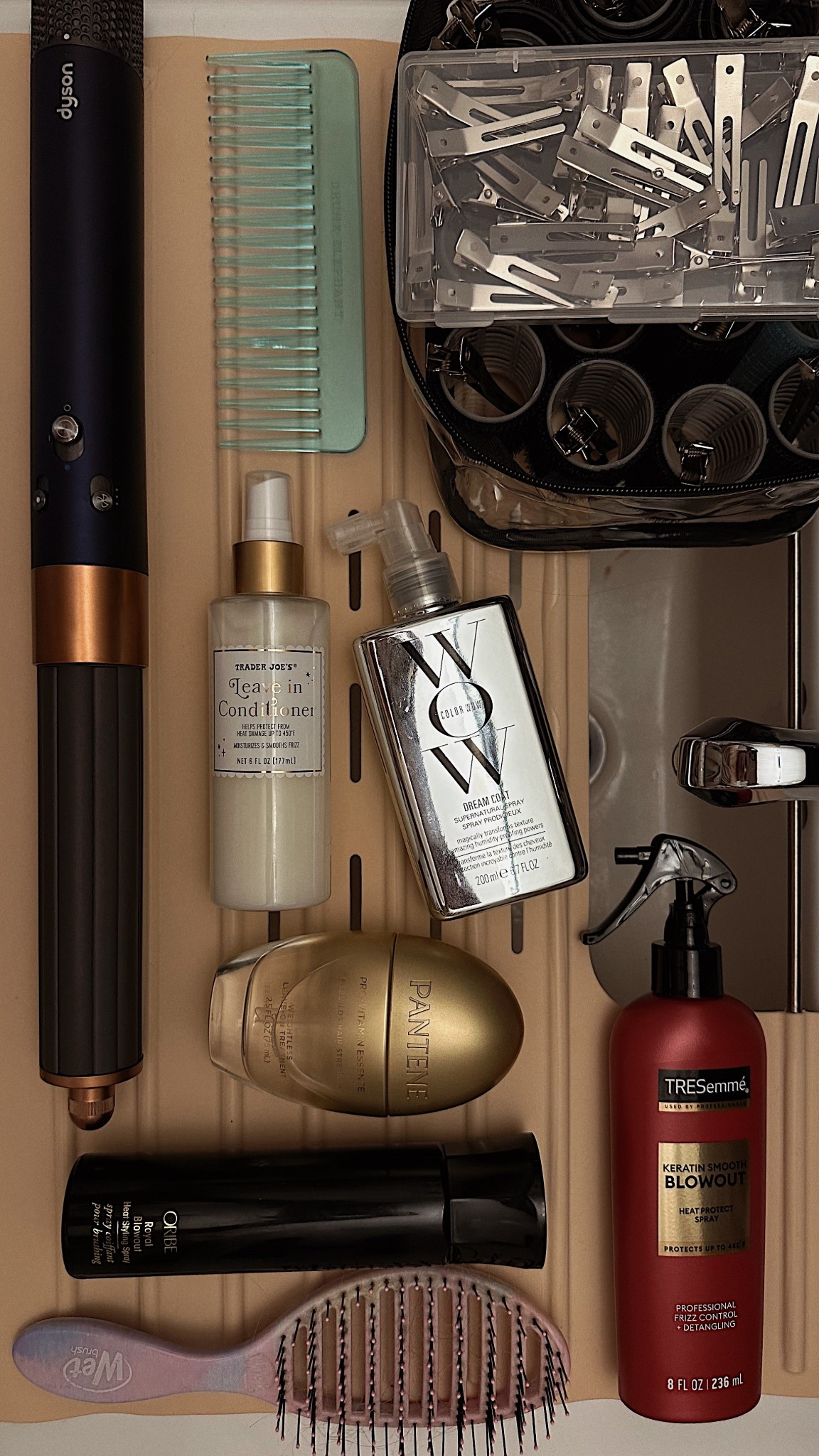 CURRENT BLOWOUT ROUTINE 

If you want big bouncy curls and have type 1a hair or straight, fine hair in general, let this be your guide.

Starting with an oldie, but a goodie, the Tresemme Keratin heat, protectant spray is super affordable and protect my hair just as well as my more expensive products. I next to use color wow Dreamcoat since it’s horrifically, humid, and hot this summer in New York City! It’s the only thing that keeps frizziness at bay.

This new Pantene strengthening treatment spray has an absolute choke hold on me. You can apply it to wet or dry hair daily and it helps strengthen color treated hair or damaged hair in general.

I recently organized all my Velcro rollers into its own carry case, which makes it easy for traveling this summer. It packs away easy, just like my Dyson and its own carrying case.

While not linked here, I feel everyone should know how great the Trader Joe’s leave in conditioner is! Dare I say it’s exactly like the Ouai one, scent and all!!

#LTKFindsUnder50 #LTKBeauty