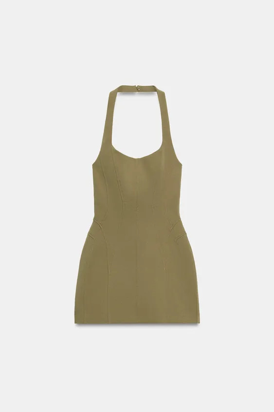 Short elastic halterneck dress with adjustable hidden buttons and round neckline. Featuring off-t... | Zara UK