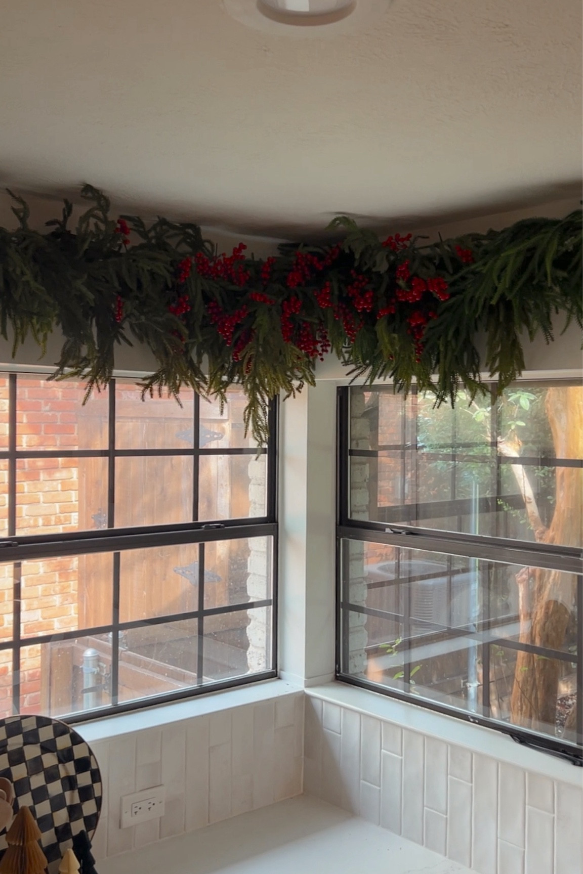 Shower curtain rod Christmas garland hack! Used 4 garland strands (2 on each rod), and berries in the center where the rods and garlands meet. Attached everything with zip ties.

#LTKSeasonal #LTKHome #LTKHoliday