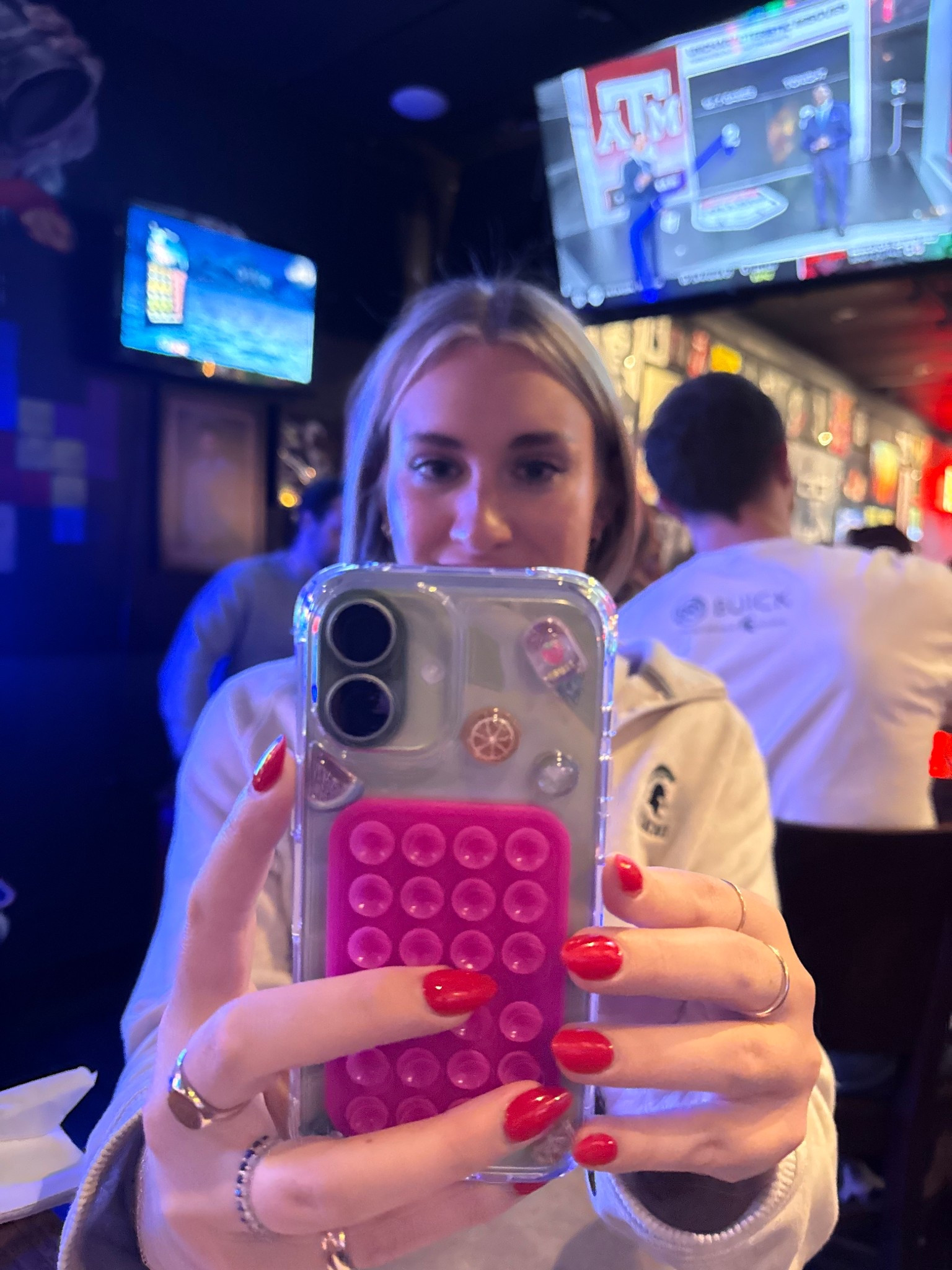 New phone check! Anyone else have the new iPhone 17? I’m so happy I went with the sage green. I wanted something that would be a fun pop of color in my daily life. 

For my first case, I went classic with an Amazon $10 staple that had great reviews. I added some fun gel stickers and a HOT pink Octobuddy for a new pop of color and freshness. 

Here I am sporting my new phone out at the bar for MSU vs. U of M. In classic fashion, MSU lost. I went for a cozy Alumni QZ, Abercrombie Jeans, a white tank, and my staple jewelry on this chill night out. 

#LTKFindsUnder50 #LTKFindsUnder100