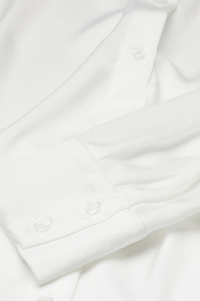 Straight-cut blouse in satin. Collar, buttons at front, and double-layered yoke with forward-faci... | H&M (US + CA)