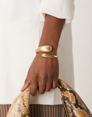 ASOS DESIGN cuff bracelet with wrap around molten detail with shiny and brushed gold tone | ASOS (Global)