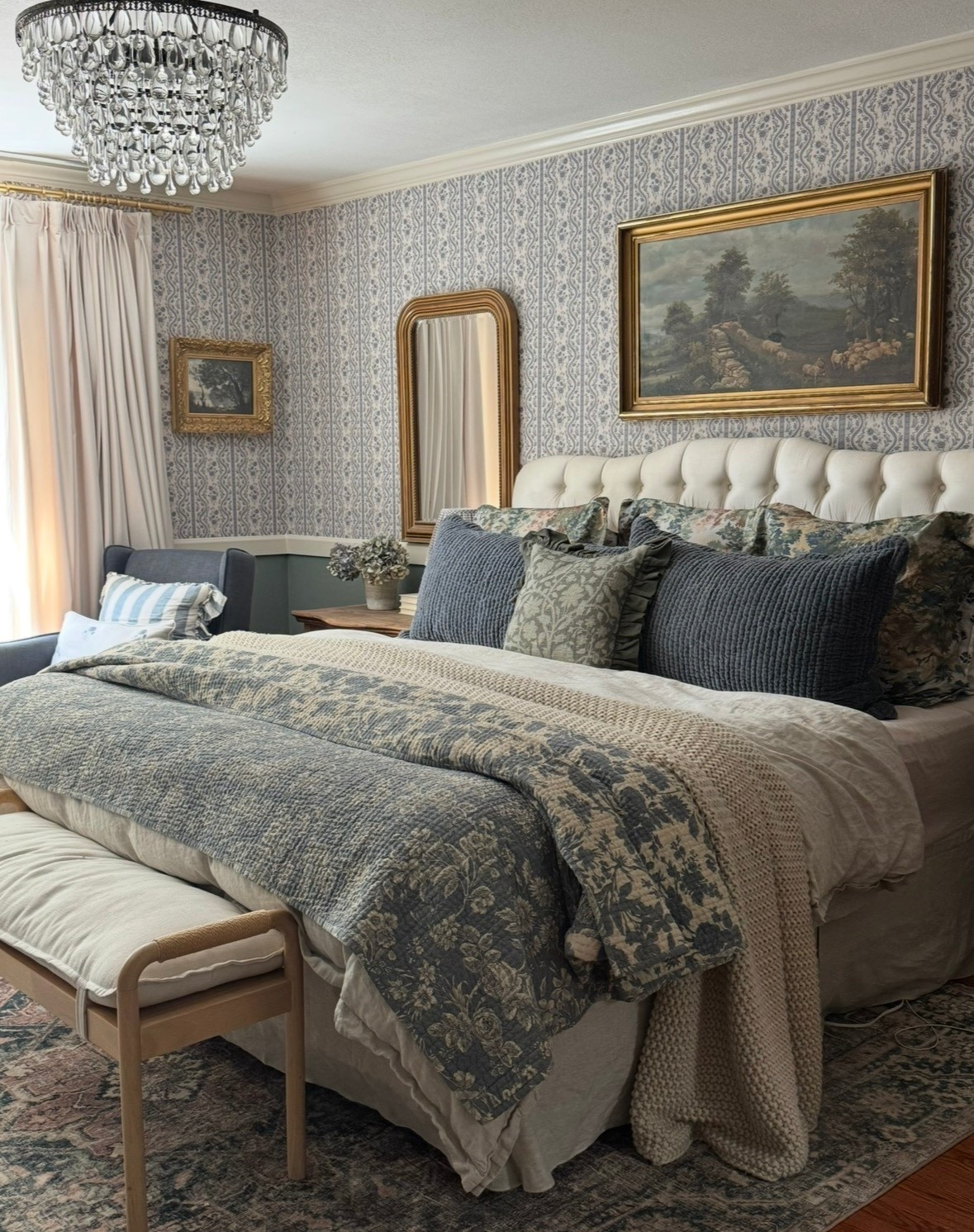 Layered bedding… linen duvet, linen bedskirt, reversible velvet scallop sham, toile percale sham, ruffled accent pillow, reversible quilt, wallpaper, crystal chandelier, rug, arch gold mirror, velvet curtains 

#LTKHome #LTKSaleAlert #LTKSeasonal