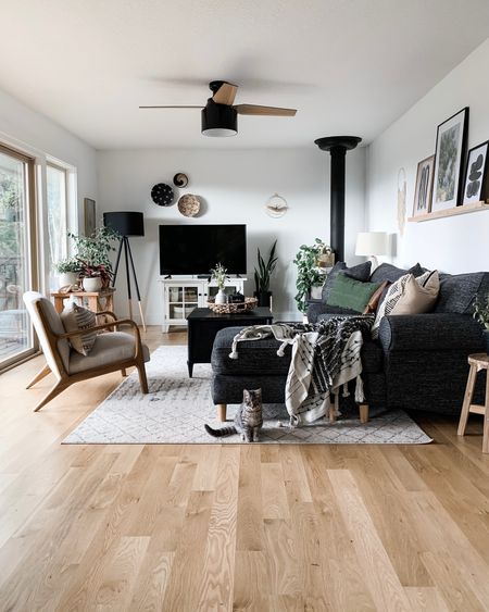 Yep, still a favorite. Sometimes I miss this cozy, neutral living room so much. From the modern ceiling fan to floating picture ledge and textured decor - this space felt like me! 🖤🌿🧺



#LTKhome