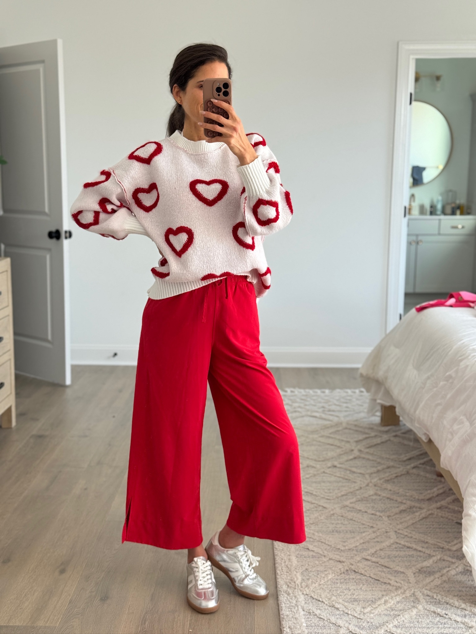 Fun, comfortable outfit that still feels effortless. Cozy heart sweater with a relaxed fit paired with flowy wide-leg pants and casual sneakers for an easy everyday look. Perfect for when you want something playful but still practical for errands, casual outings, or a laid-back day.

Casual outfit, everyday outfit, heart sweater, red pants outfit, wide leg pants, comfy outfit, casual chic style, playful sweater, mom outfit, affordable fashion

#LTKSeasonal #LTKFindsUnder50 #LTKootd