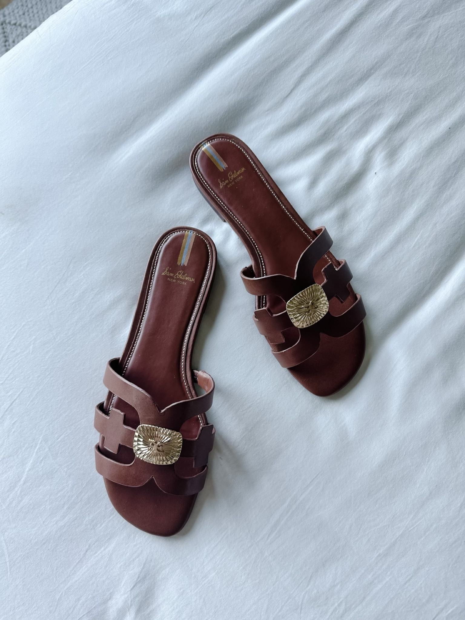 Summer slides with a medallion 

#slides#sandals #summer #spring #samedelman

#LTKFind #LTKSeasonal #LTKshoecrush