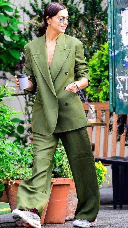 Shop Irina Shayk green double breasted blazer suit jacket and matching wide leg pants trousers Nike sneakers and look for less dupe options #irinashayk #CelebrityStyle

#LTKWorkwear #LTKStyleTip