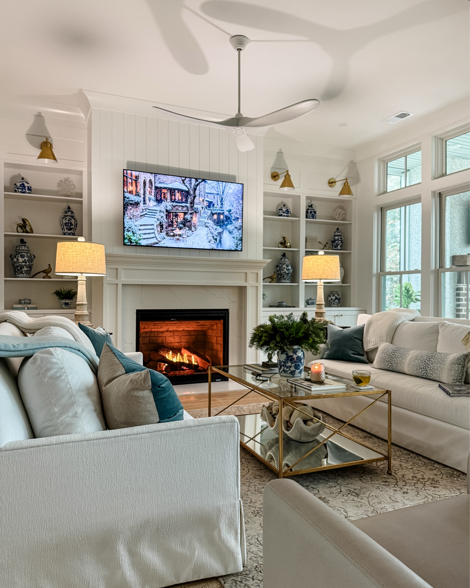 Rainy afternoon favorites. 🤍 Fireplace on, a candle lit, and all the soft layers that make this room feel calm and lived in. Sharing sources for a few cozy details here.

#LTKHome