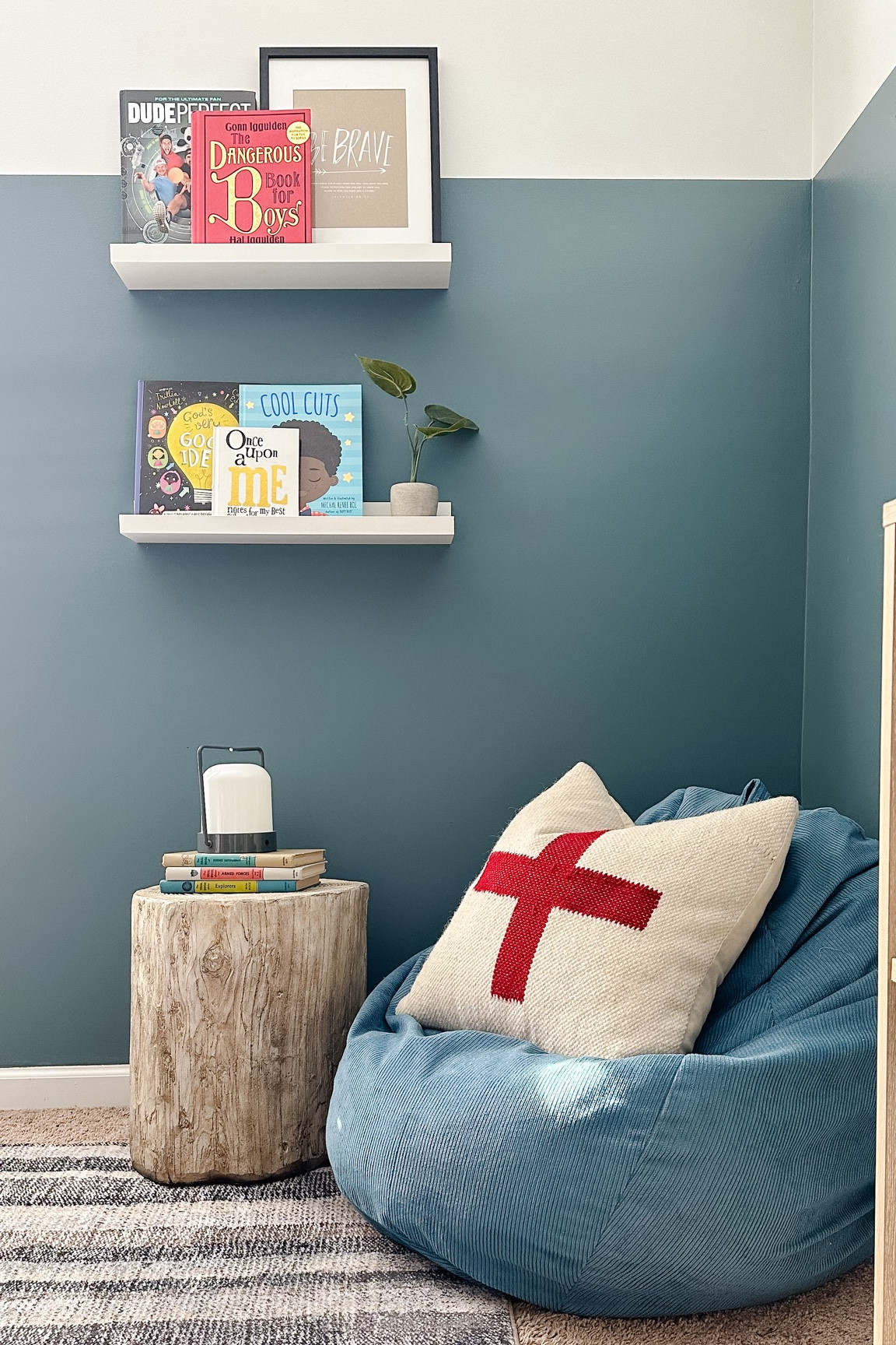 Cozy corner in a boys room, bean bag stuffed animal storage, tree stump table, shelfie, fun books for boys, Swiss cross pillow, home decor 

#LTKfamily #LTKhome #LTKkids