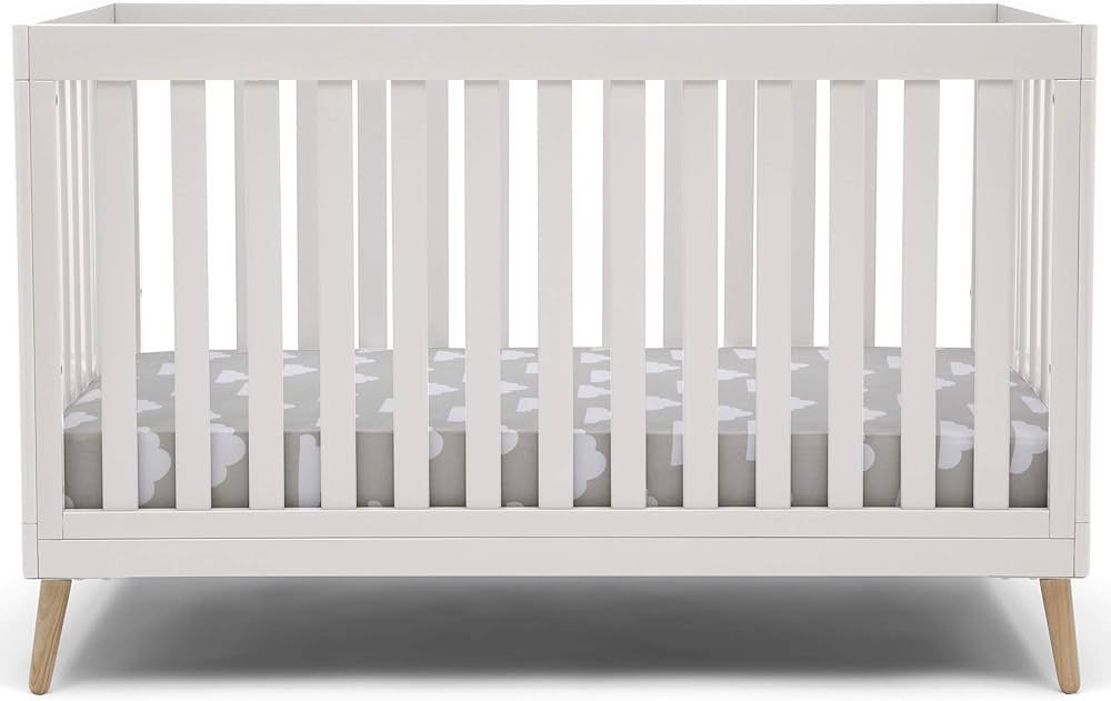Delta Children Essex 4-in-1 Convertible Baby Crib, Bianca White with Natural Legs | Amazon (US)