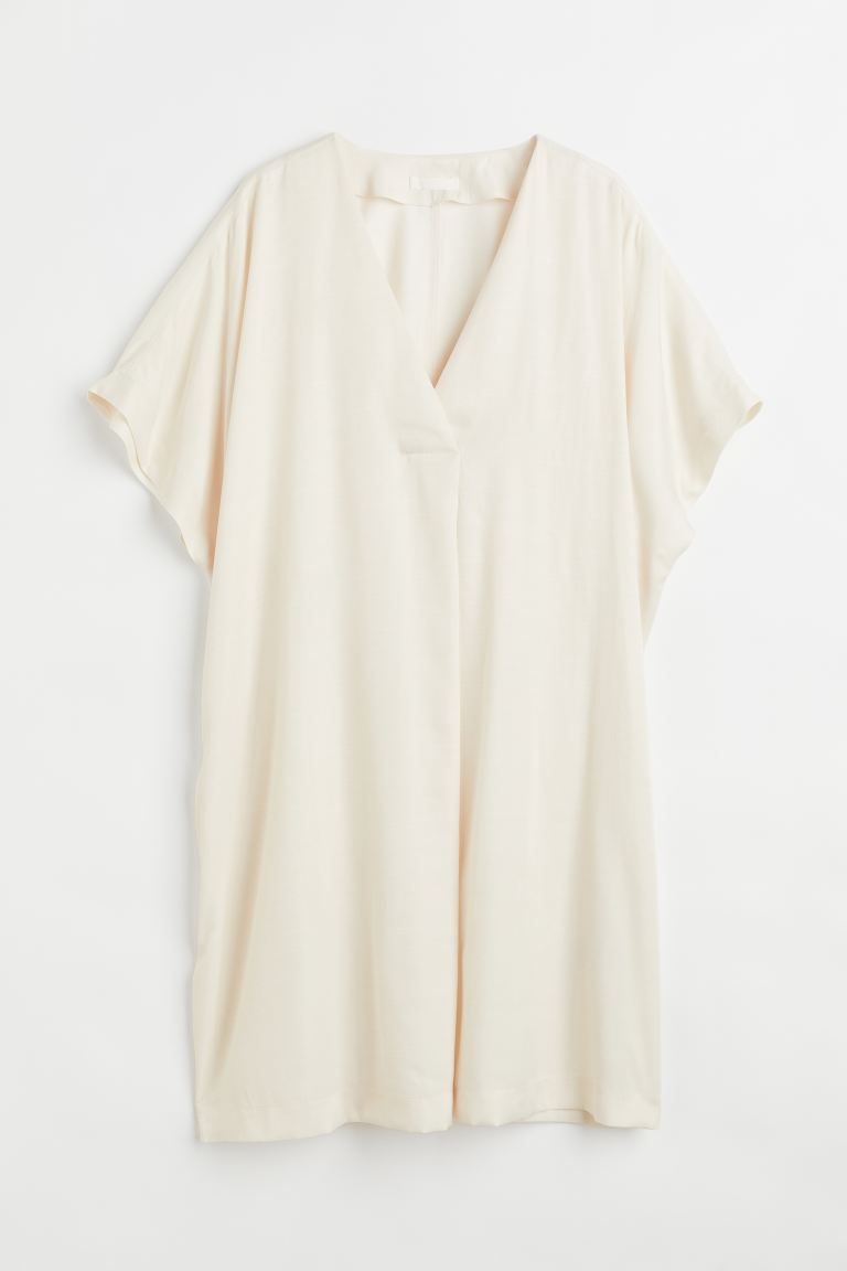 New ArrivalKnee-length dress in woven fabric with a slight sheen. V-neck, pleat at front for a dr... | H&M (US + CA)