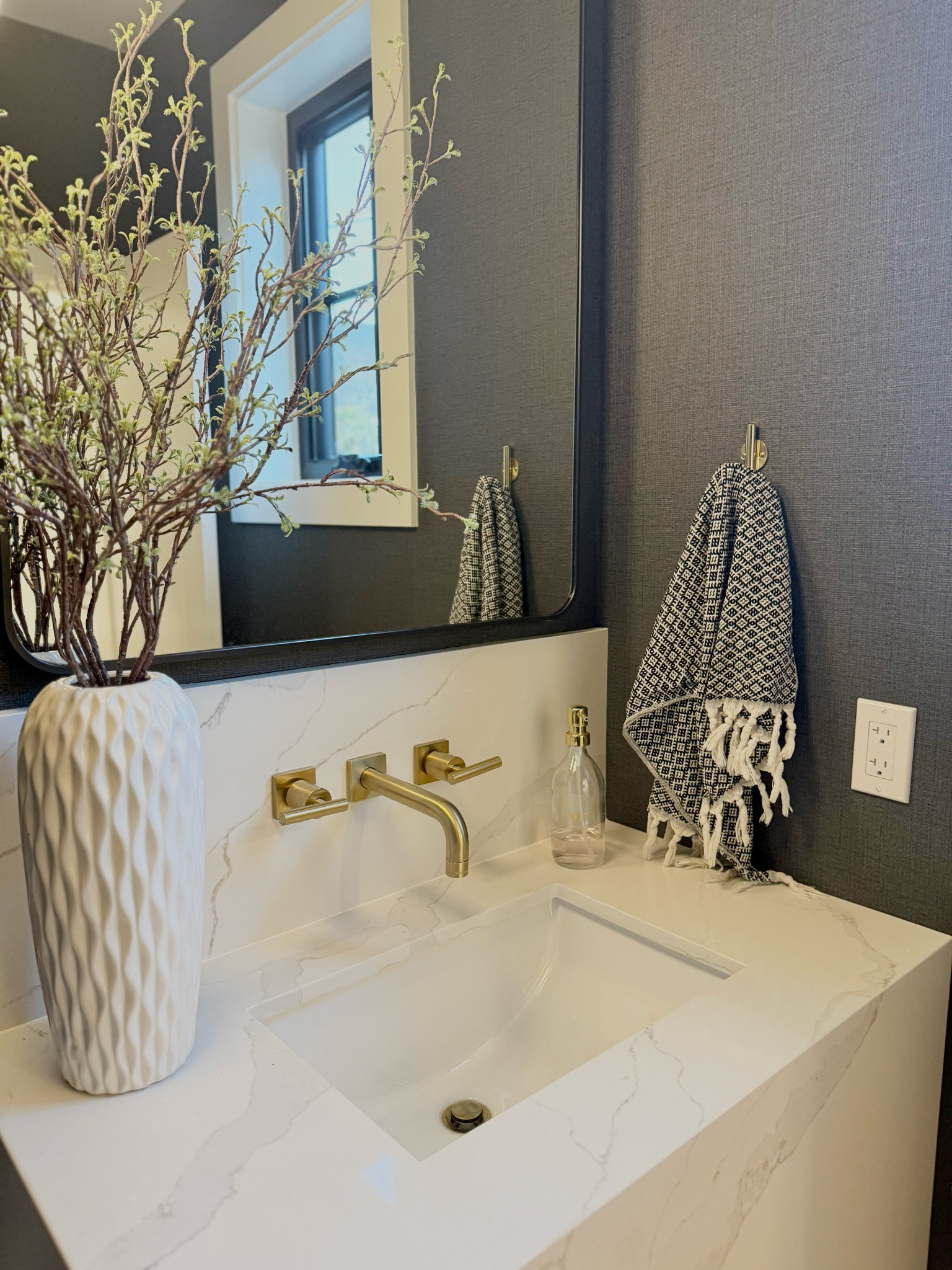 Bathroom Before and After 🤍

With my new home build coming to completion I am so excited to share with you all the before and afters! This powder bathroom is one of my absolute favorite spaces in the home and I just love how the moody textured wallpaper plays off the stone vanity! 

For this space I wanted to make a statement and going with dark textured wallpaper was a must for this space. The wallpaper I used was custom however I’ve linked a very similar and affordable option! For the vanity, I went with a custom Calcatta quartz that gives the look of marble but is super durable and easy to clean. Choosing to float the vanity gives it a super modern and custom look that ties the space together! 

#LTKHome