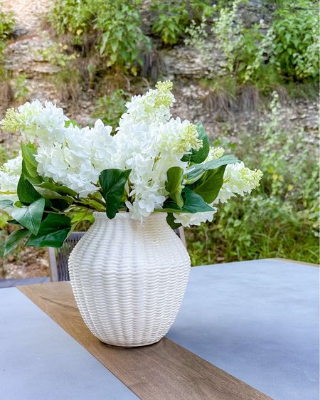 Gorgeous faux lilacs and vase on sale! I have 3 bunches here. Perfect for summer outdoor entertaining decor or a dining table centerpiece!

#LTKSaleAlert #LTKFindsUnder50 #LTKHome