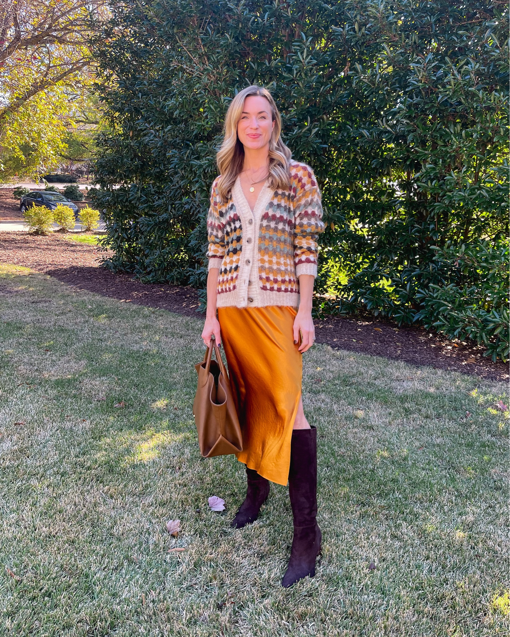 Daily look wearing BA&SH cardigan, Vince skirt, KHAITE tote, Vince boots. Similar, less expensive to recreate the look also linked!